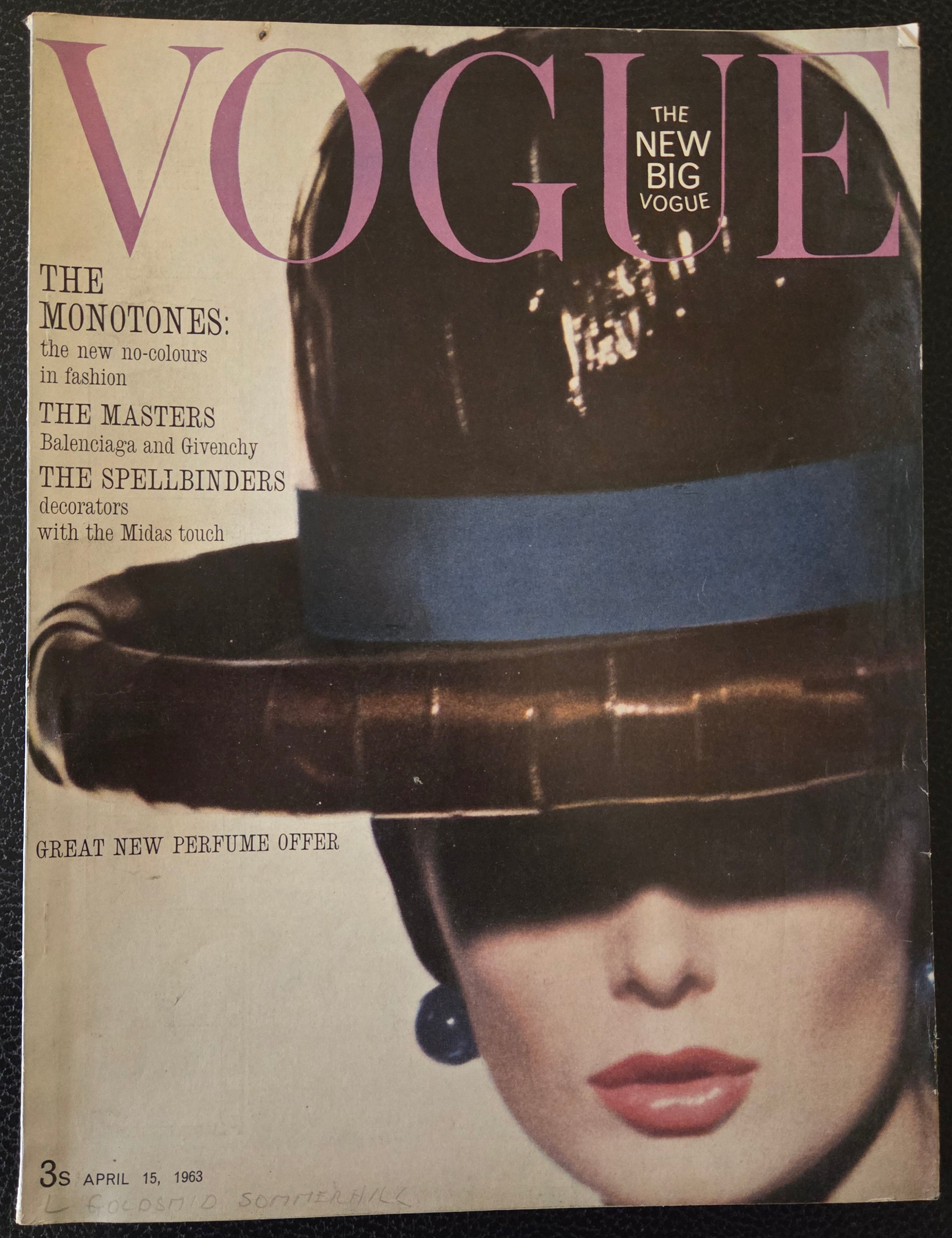 Vintage Vogue magazine cover with a woman's face and text