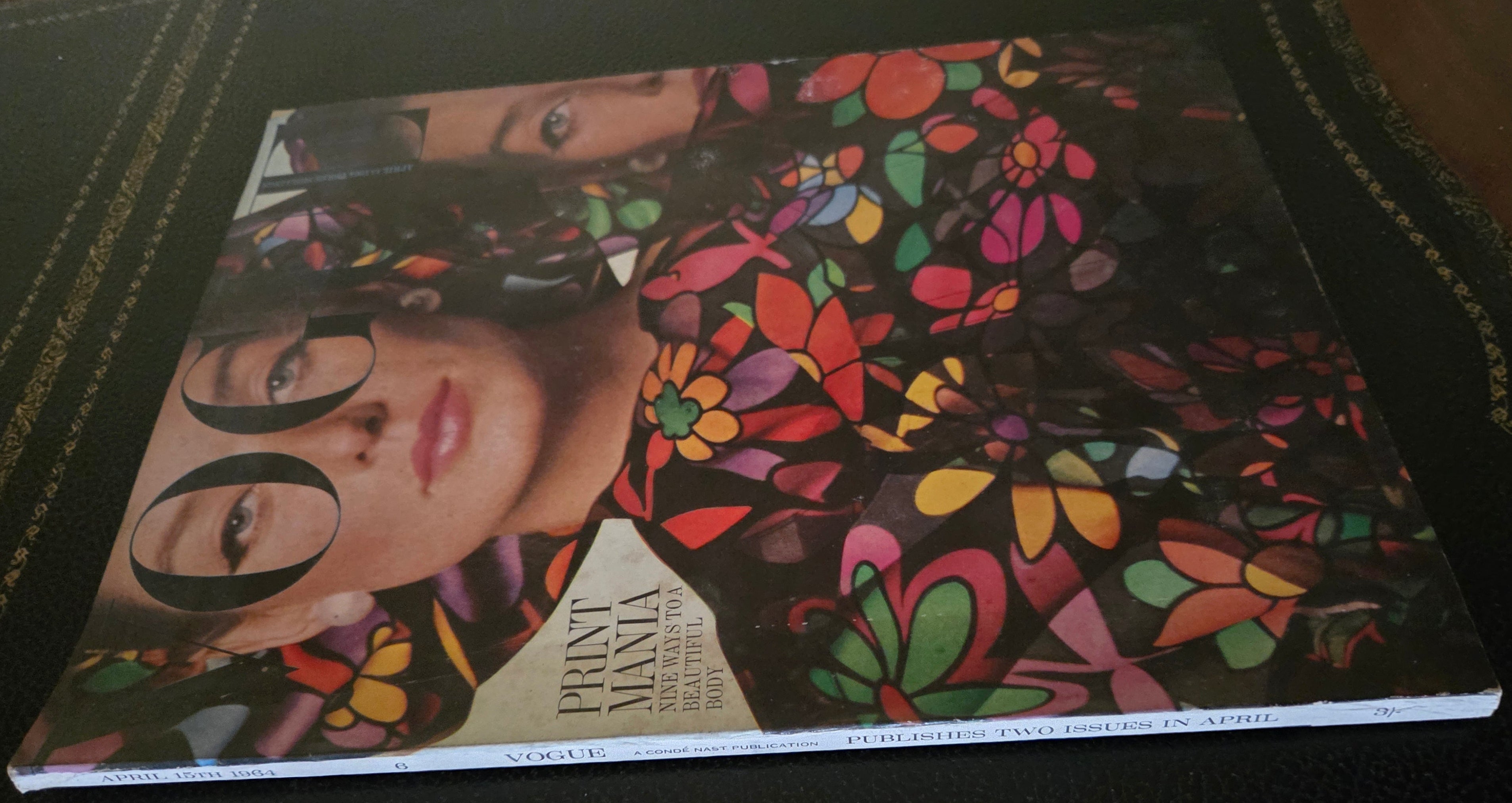 Vogue April 1964 with floral outfitted models.