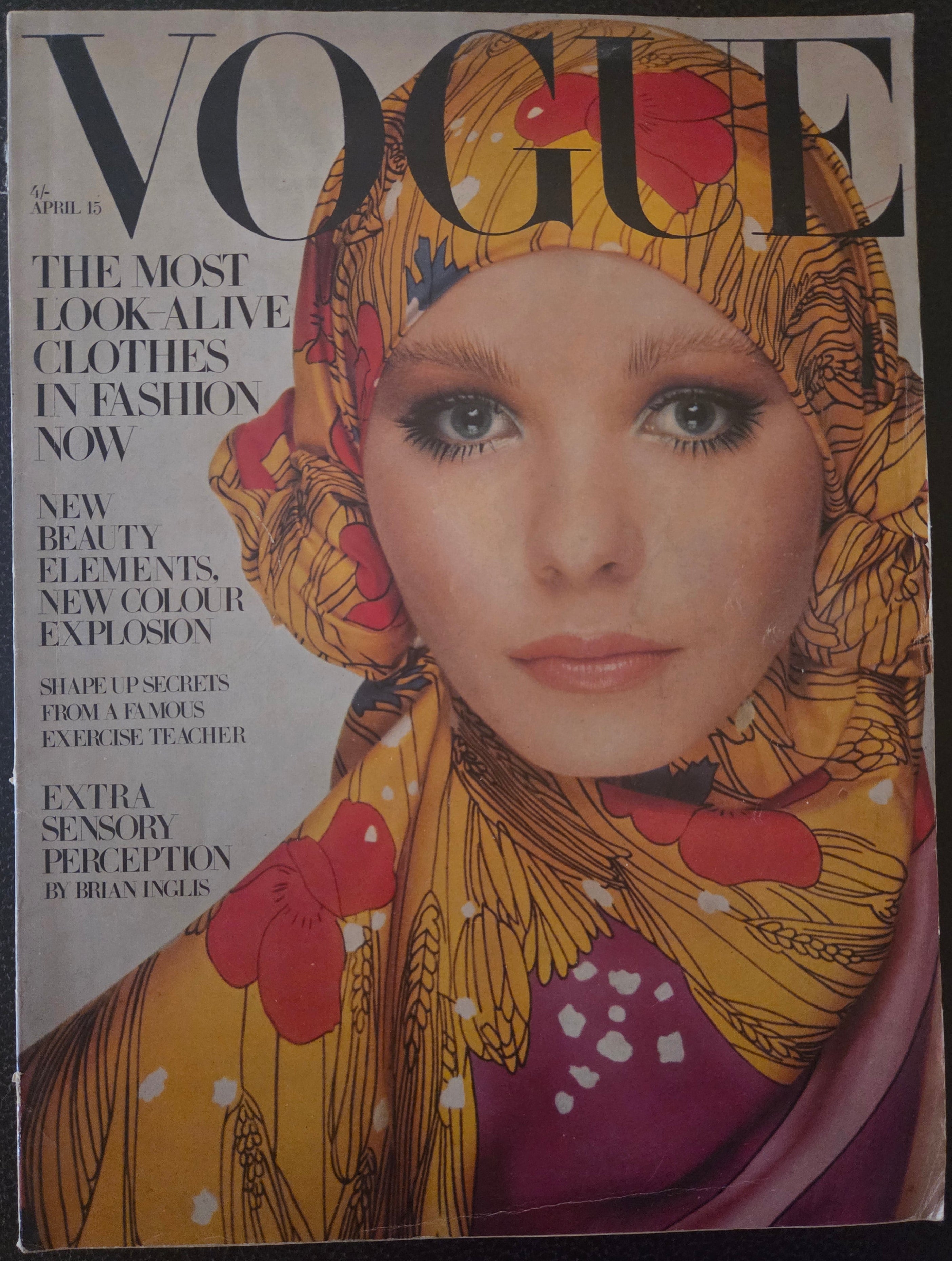 Vogue with model in golden headscarf.