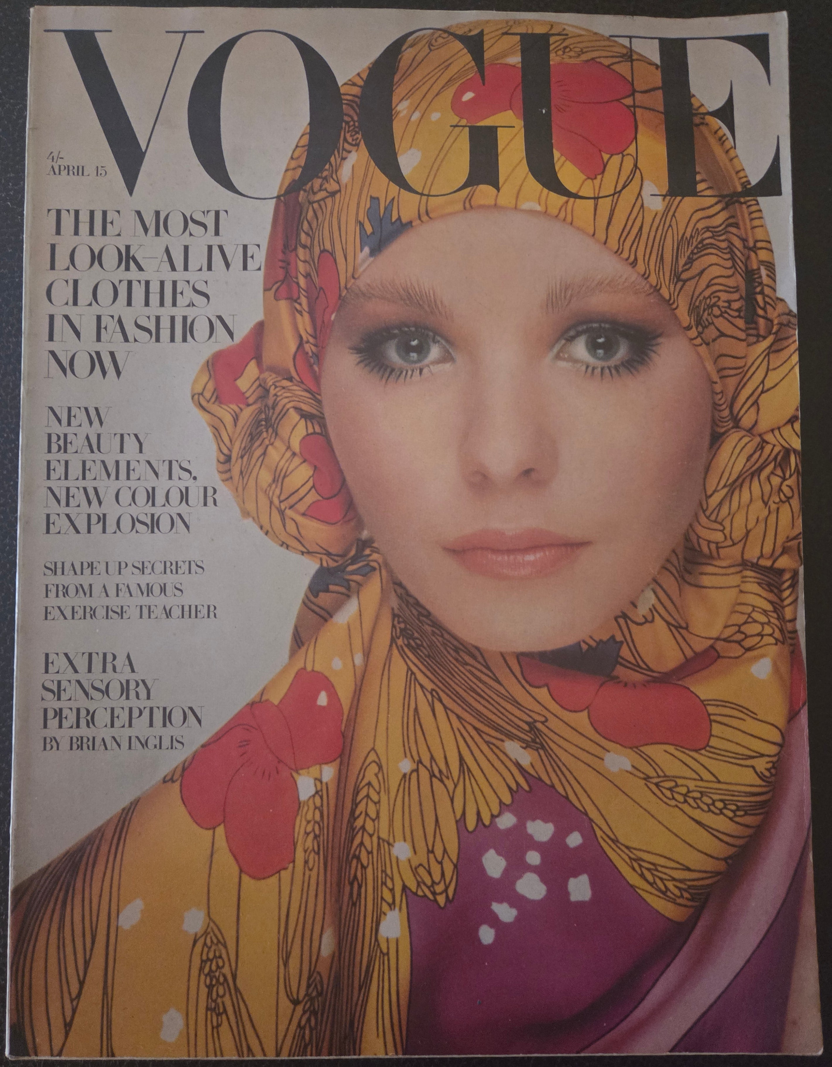 Vogue with model in golden headscarf