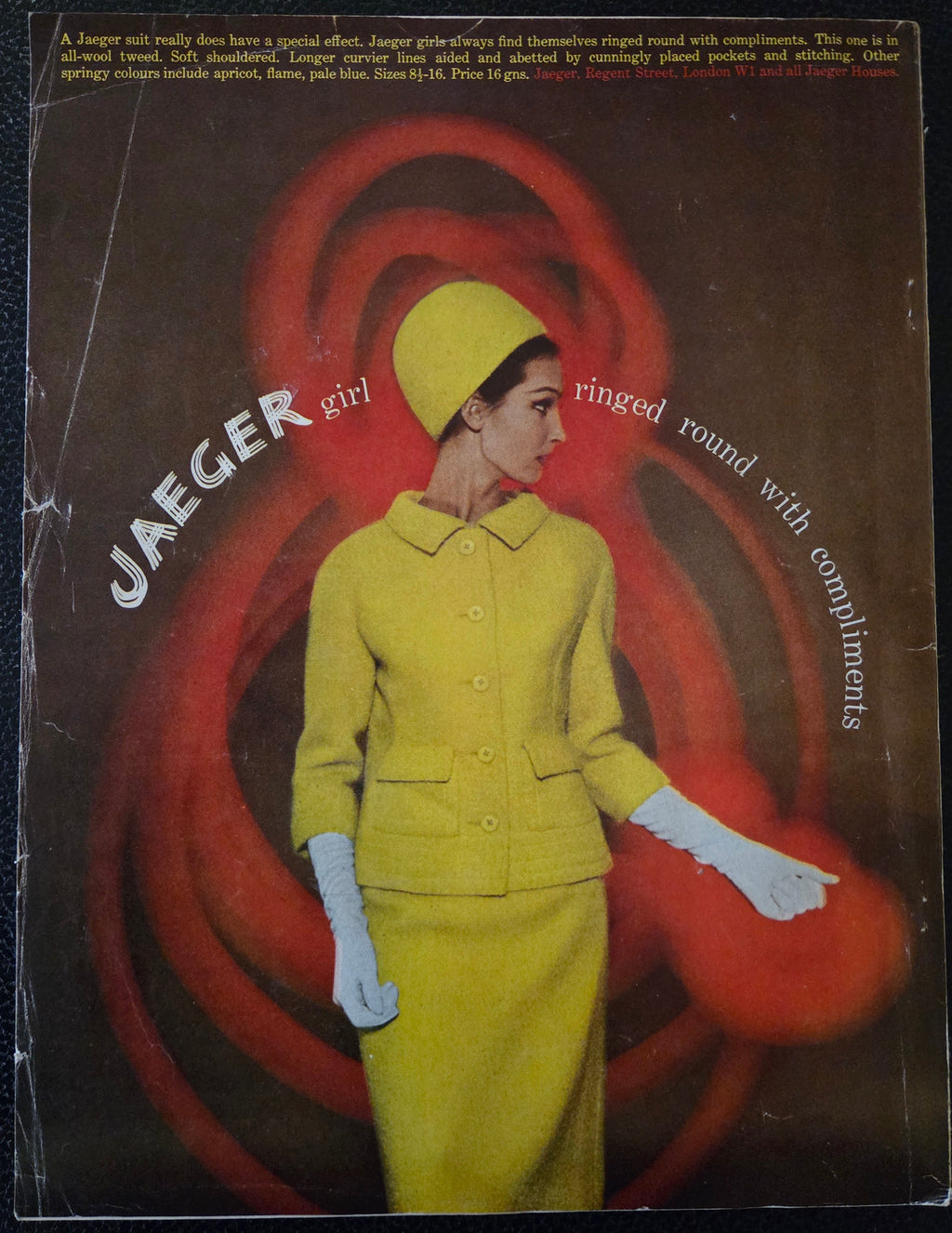 Vintage Jaeger advertisement for a yellow outfit with a red abstract design on a dark background