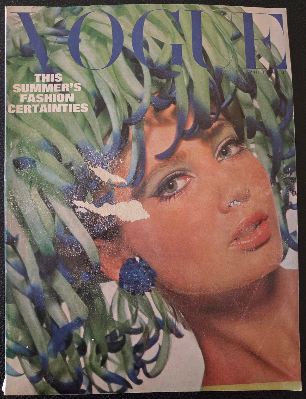 Vintage Vogue magazine cover with a model wearing a headpiece