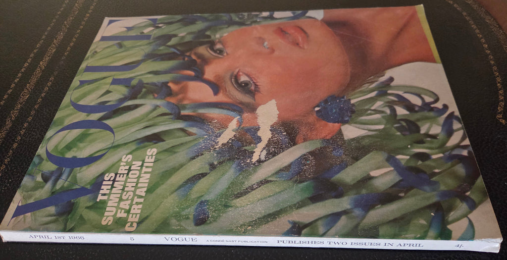 Vogue with model wearing headdress.