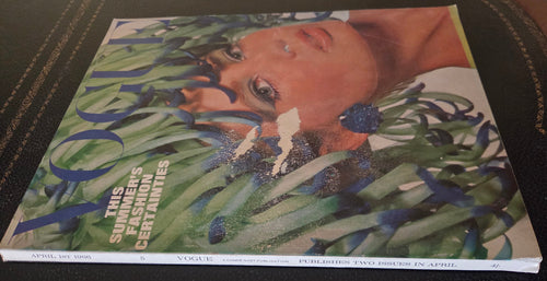 Vogue with model wearing headdress.