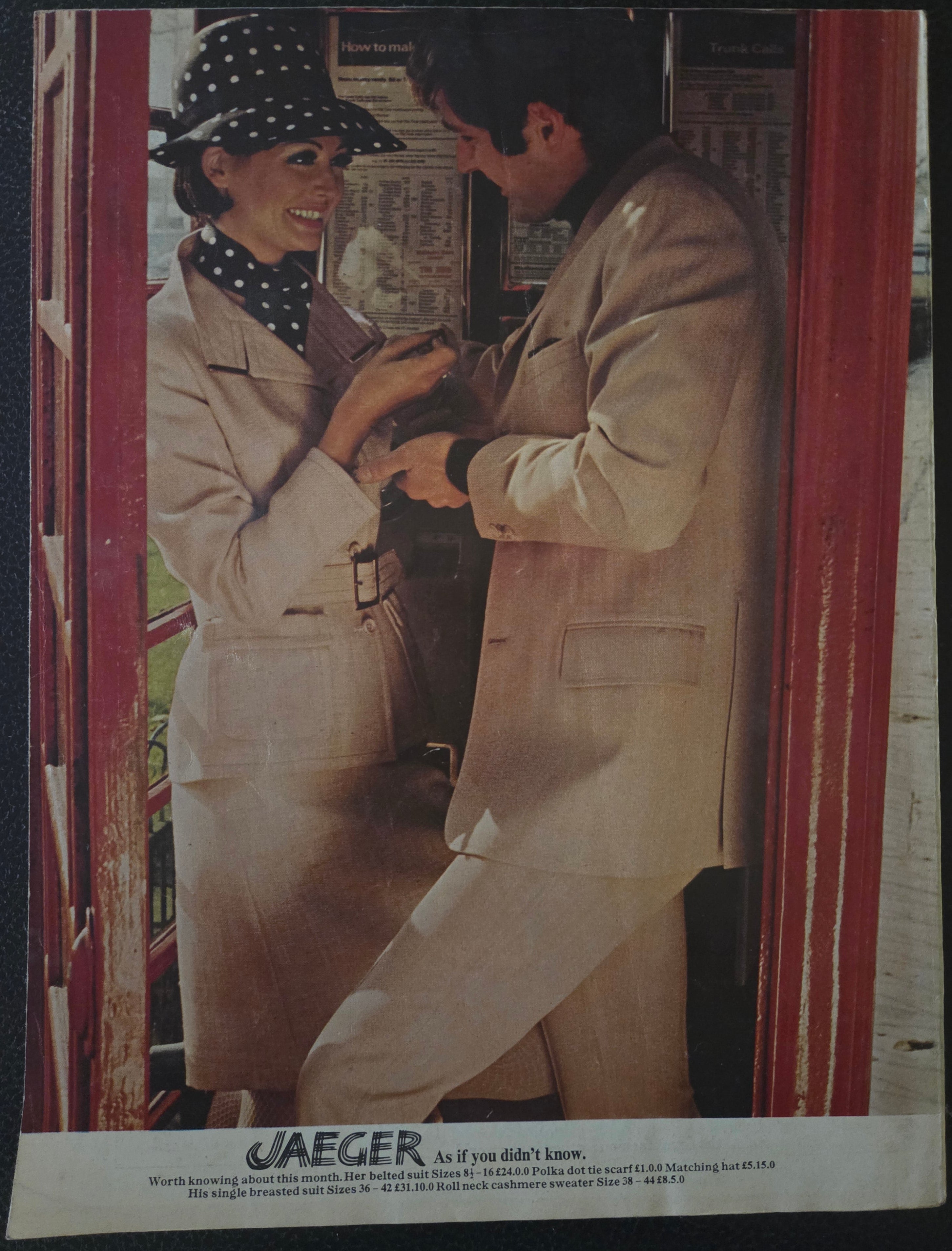 Vintage advertisement featuring a man and woman in a phone box with 'Jaeger' branding.