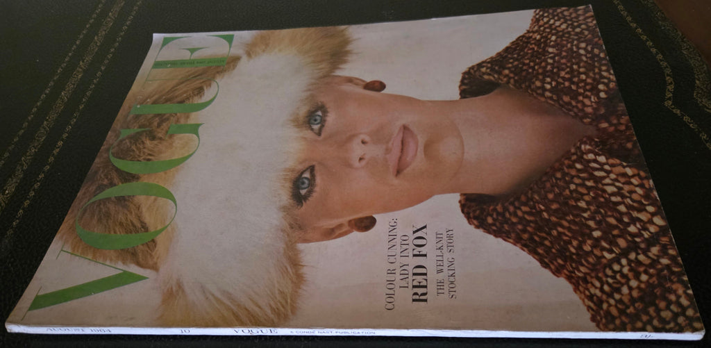 Vintage vogue with a model wearing a fur hat.