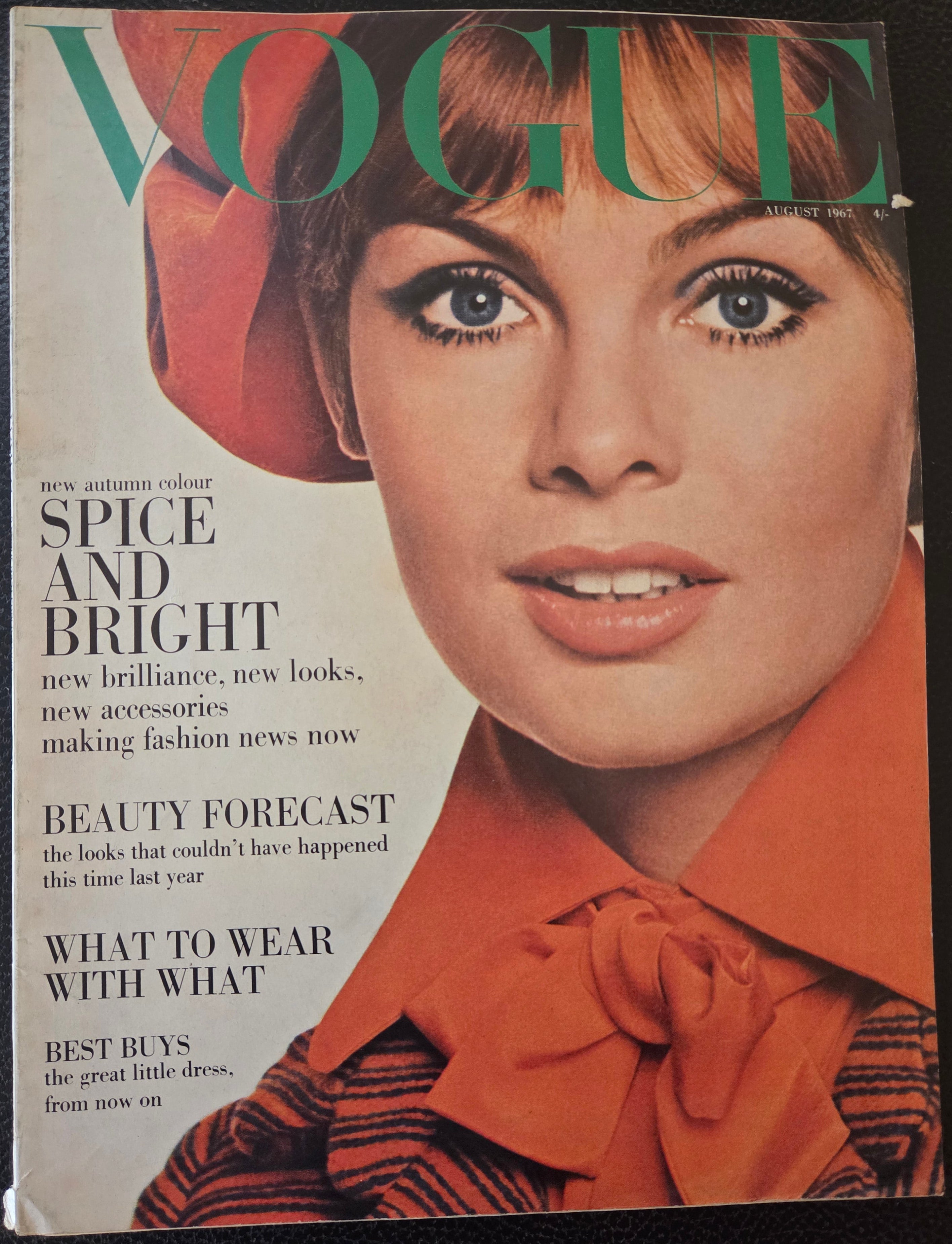 Vintage Vogue magazine cover with a woman's face and text