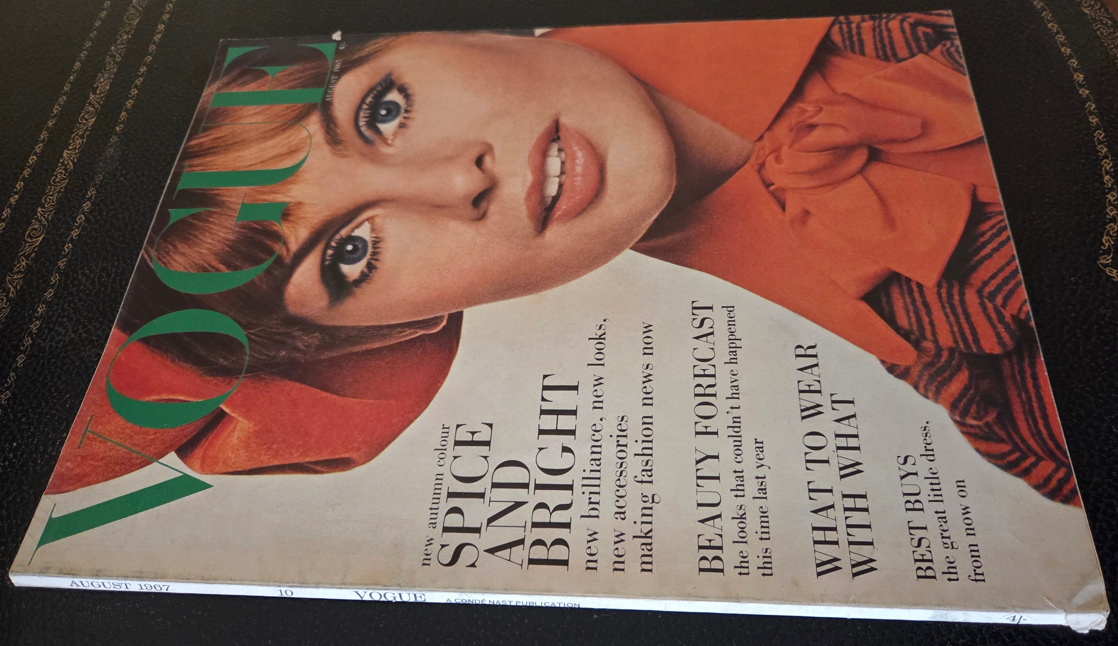 Vogue magazine with model in orange.