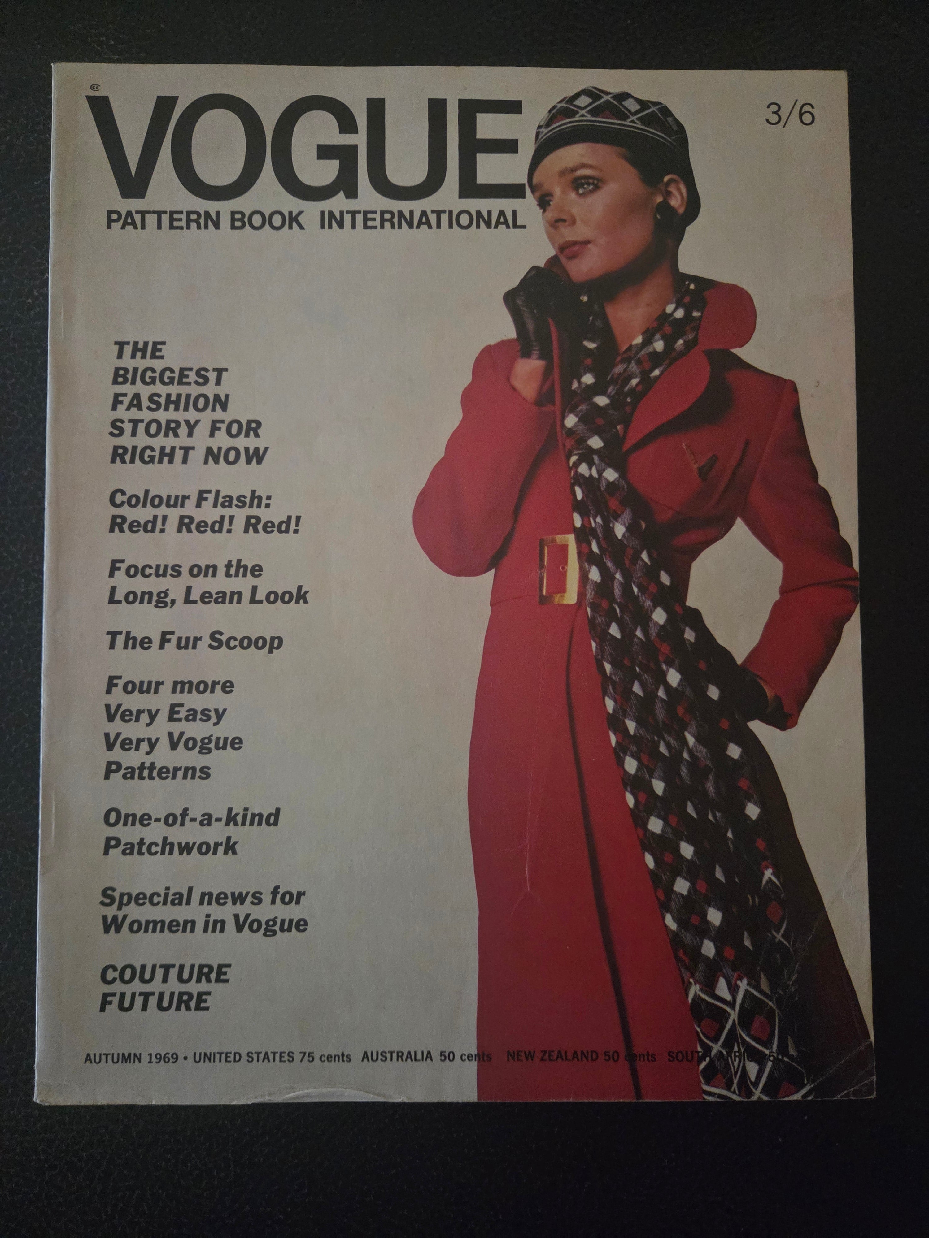 Vintage Vogue pattern book cover with a model wearing a red coat and patterned scarf