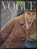 Vogue magazine cover featuring a model wearing a patterned coat.