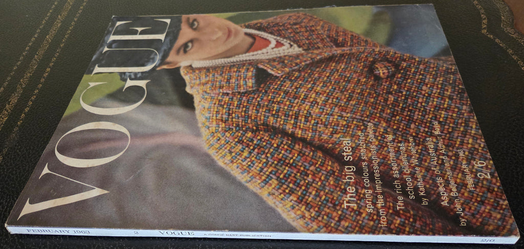Vogue magazine cover with a person wearing a patterned coat