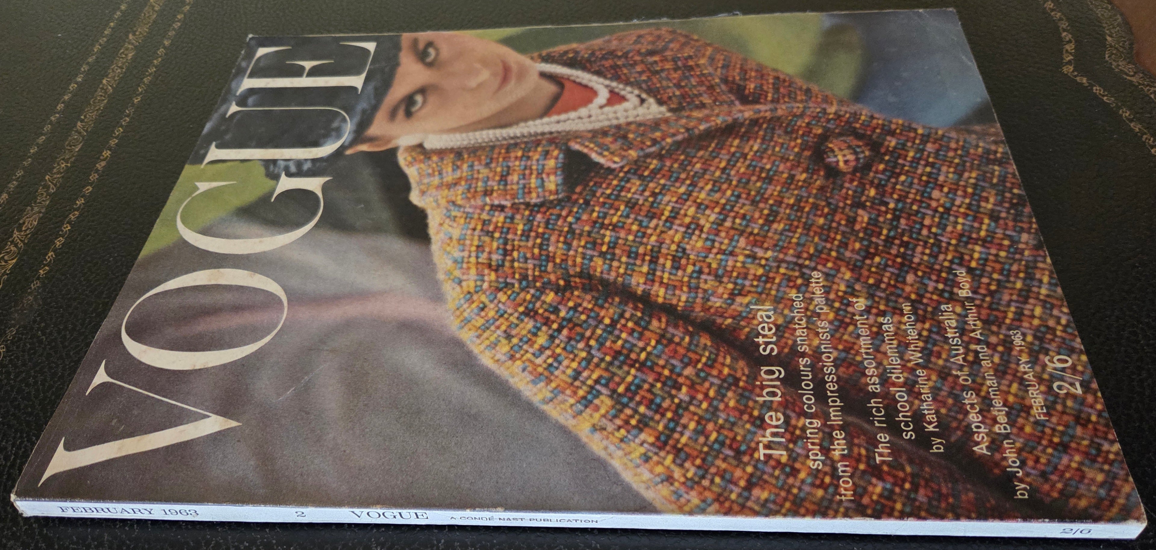 Vogue magazine cover with a person wearing a patterned coat