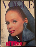 Vogue with model wearing blue fabric earrings