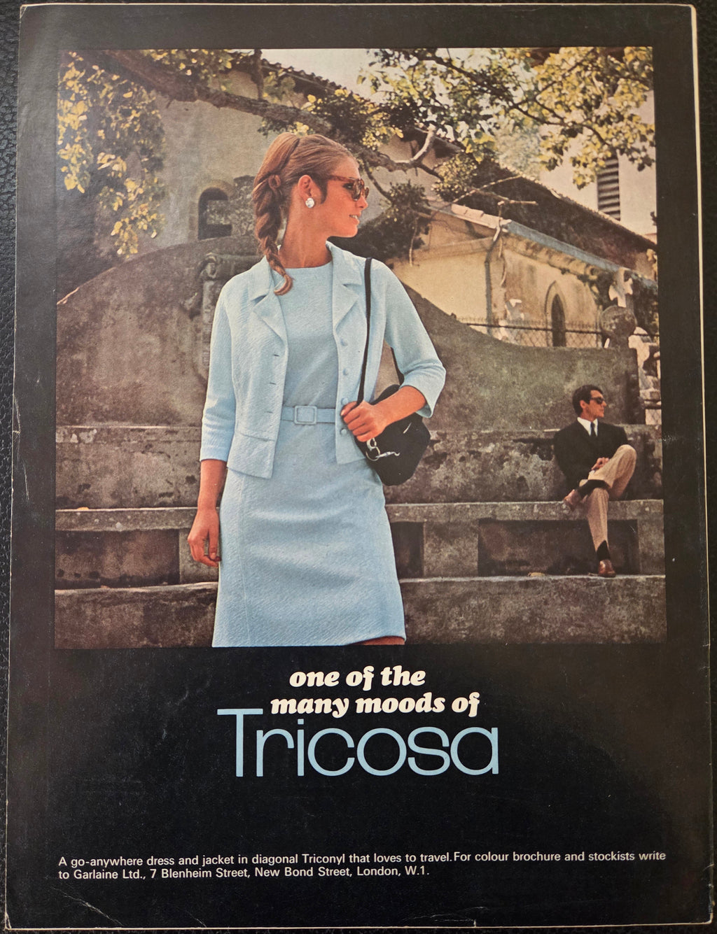 Vintage advertisement for Tricosa clothing with a woman in a light blue outfit