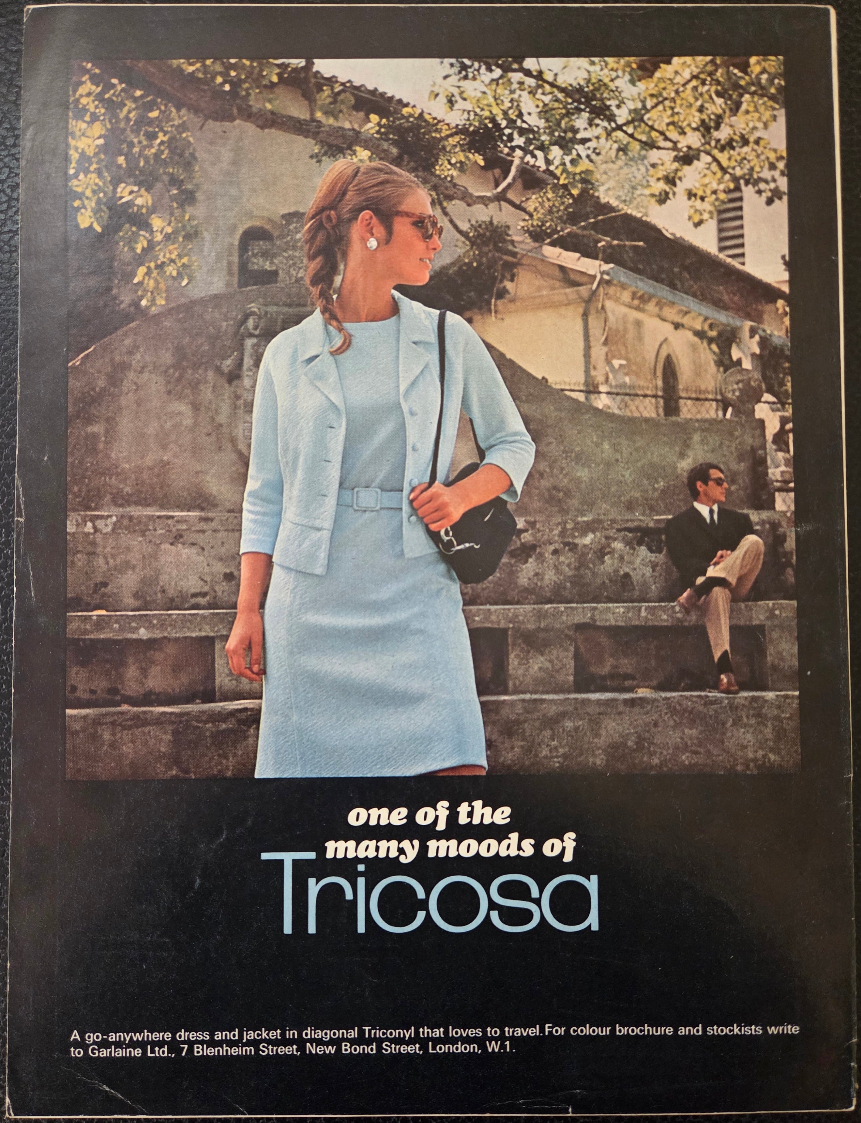 Vintage advertisement for Tricosa clothing with a woman in a light blue outfit