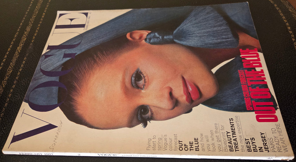 Vogue featuring model with blue fabric earrings