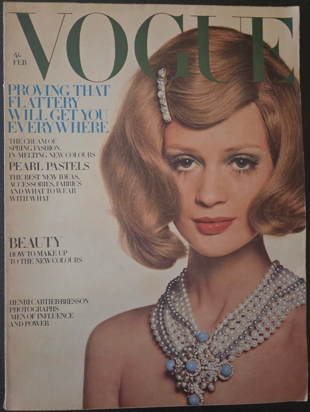 Vogue with model wearing pearl necklace