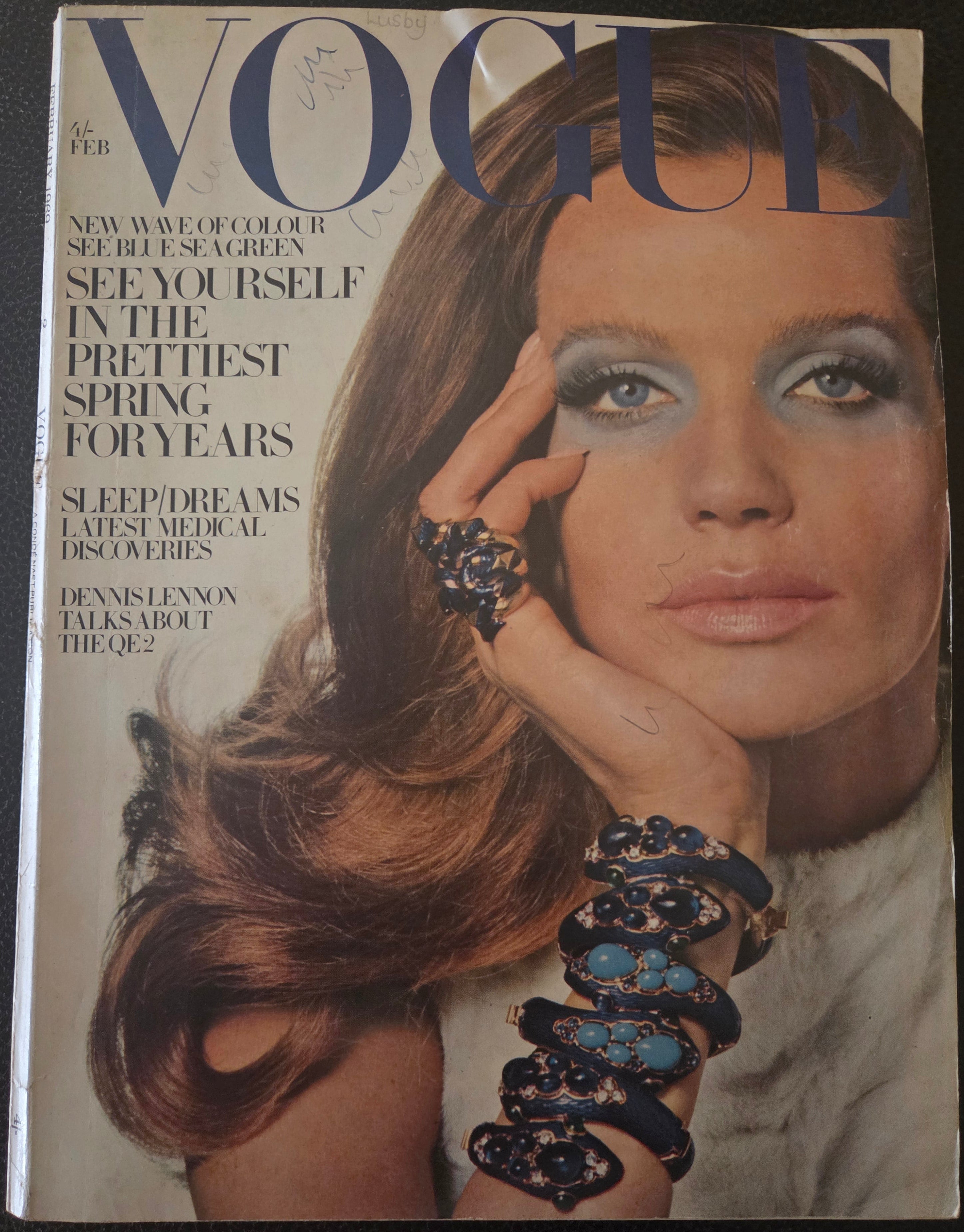 Vintage Vogue magazine cover with a model wearing jewelry