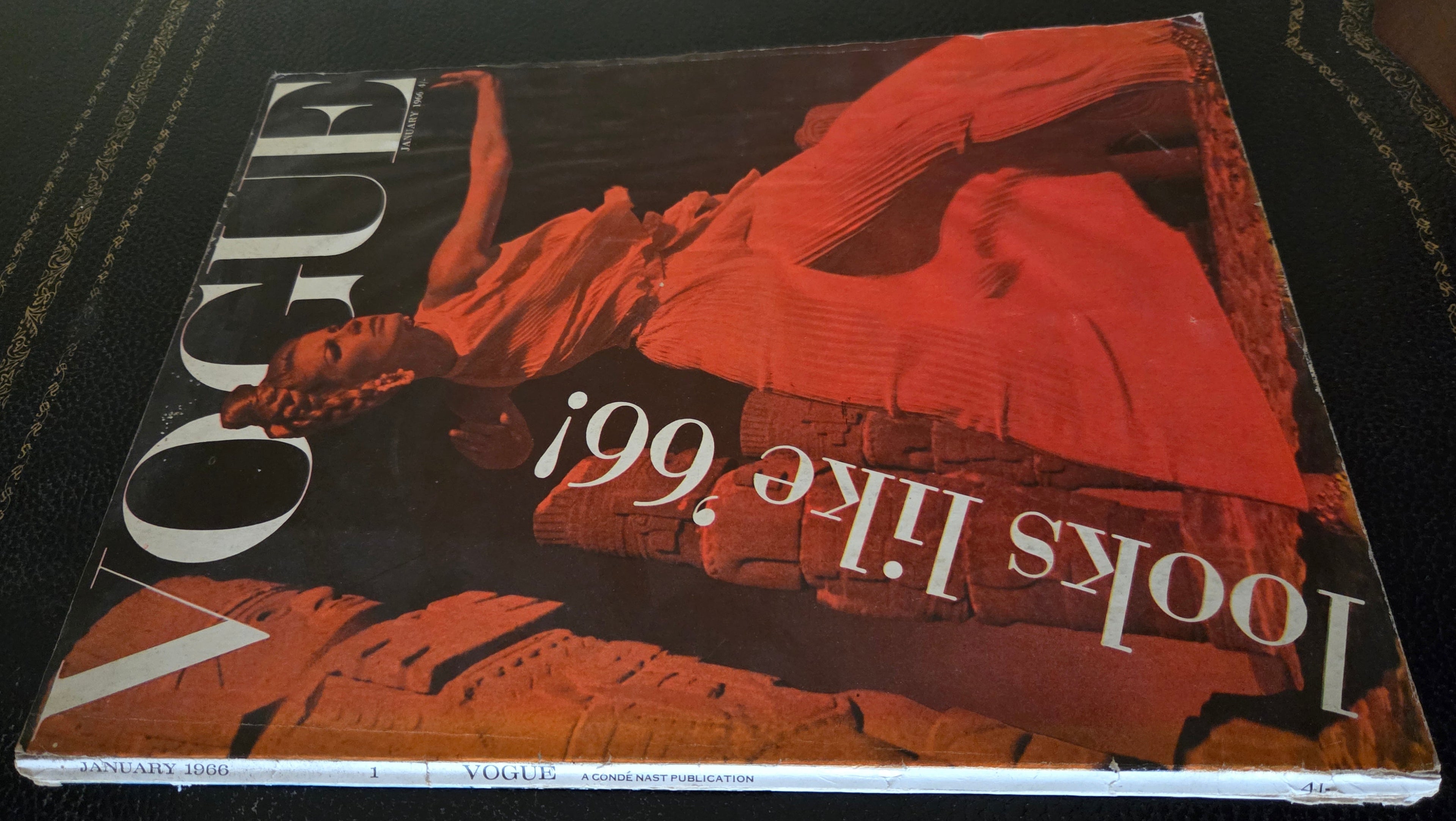 Vintage vogue with model with red filter in front of ancient monuments.