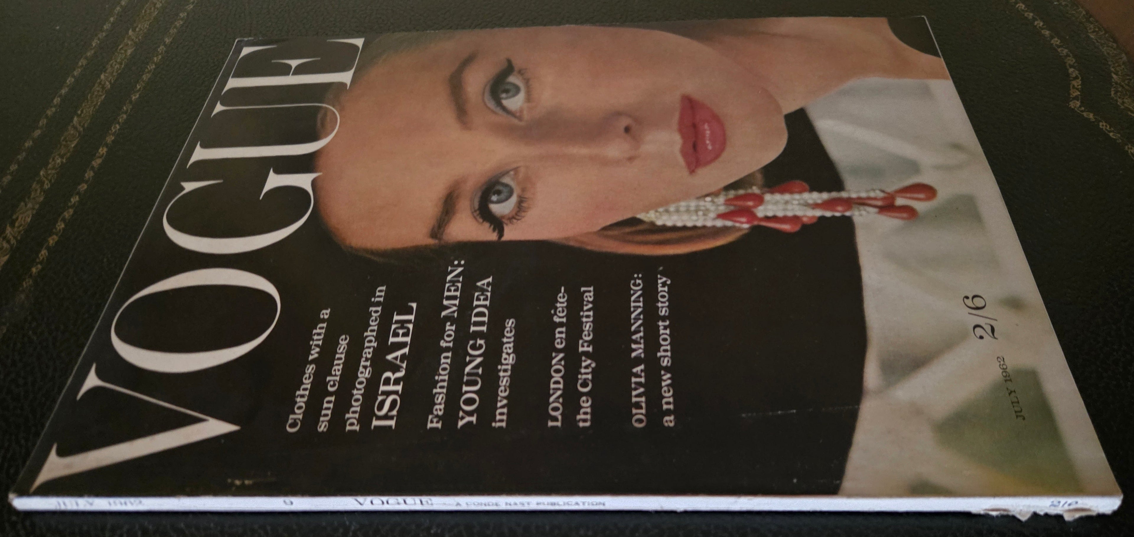 Vogue magazine with a cover featuring a model with jewelry