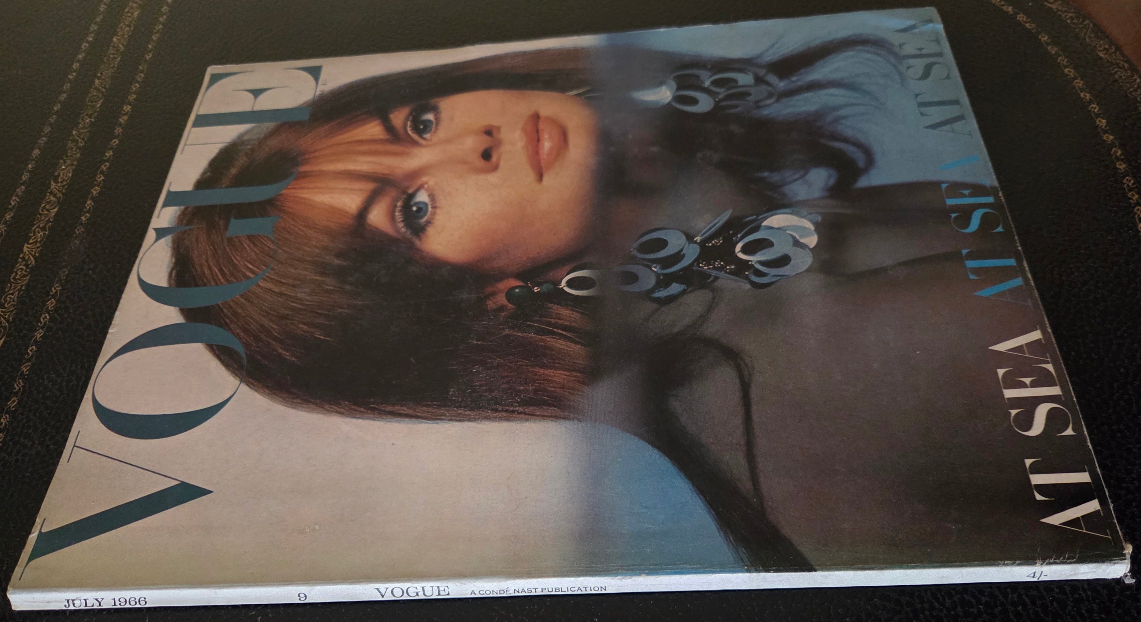 Vogue with model half in water.