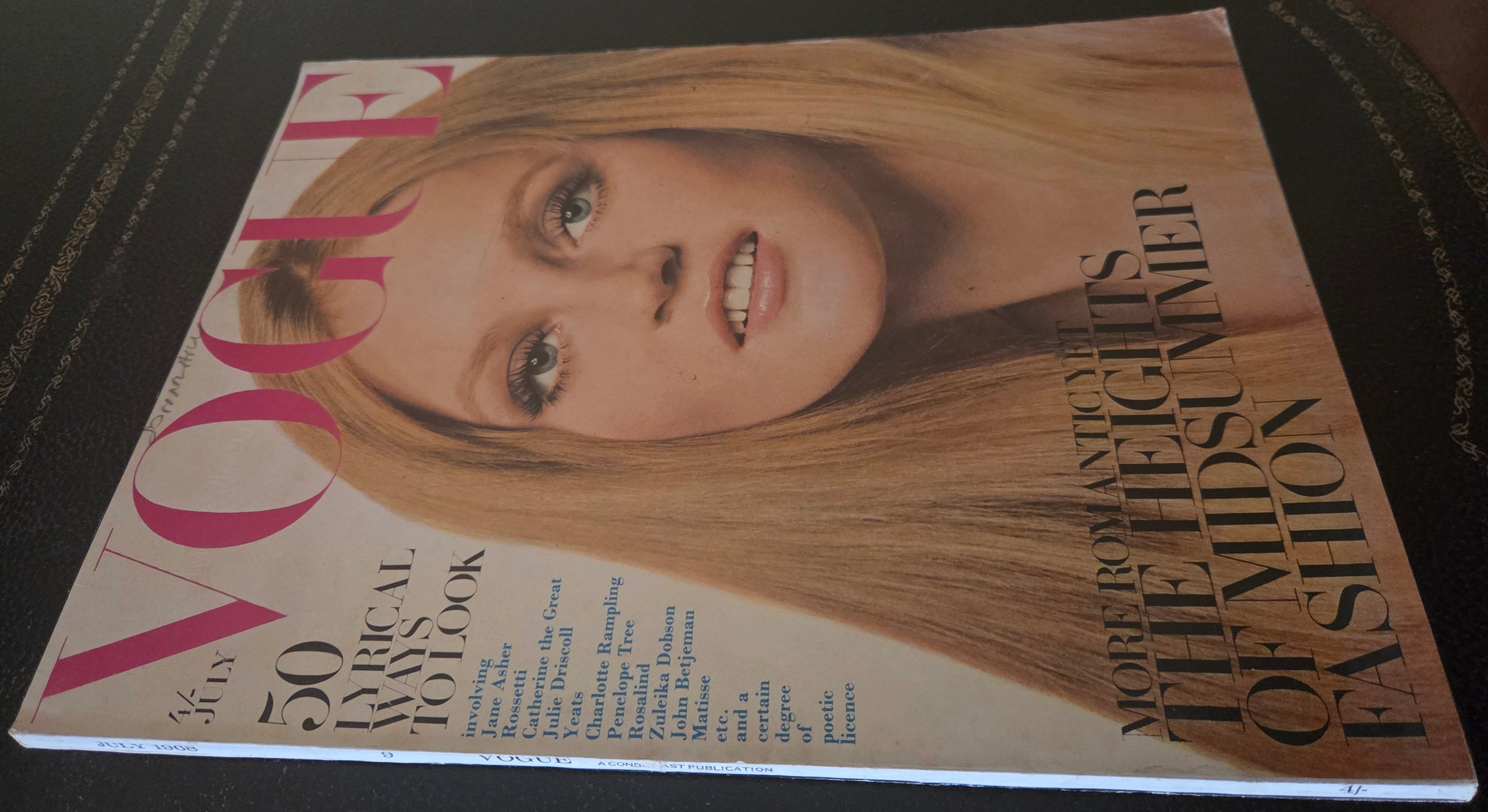 Vogue with model's face on cover.