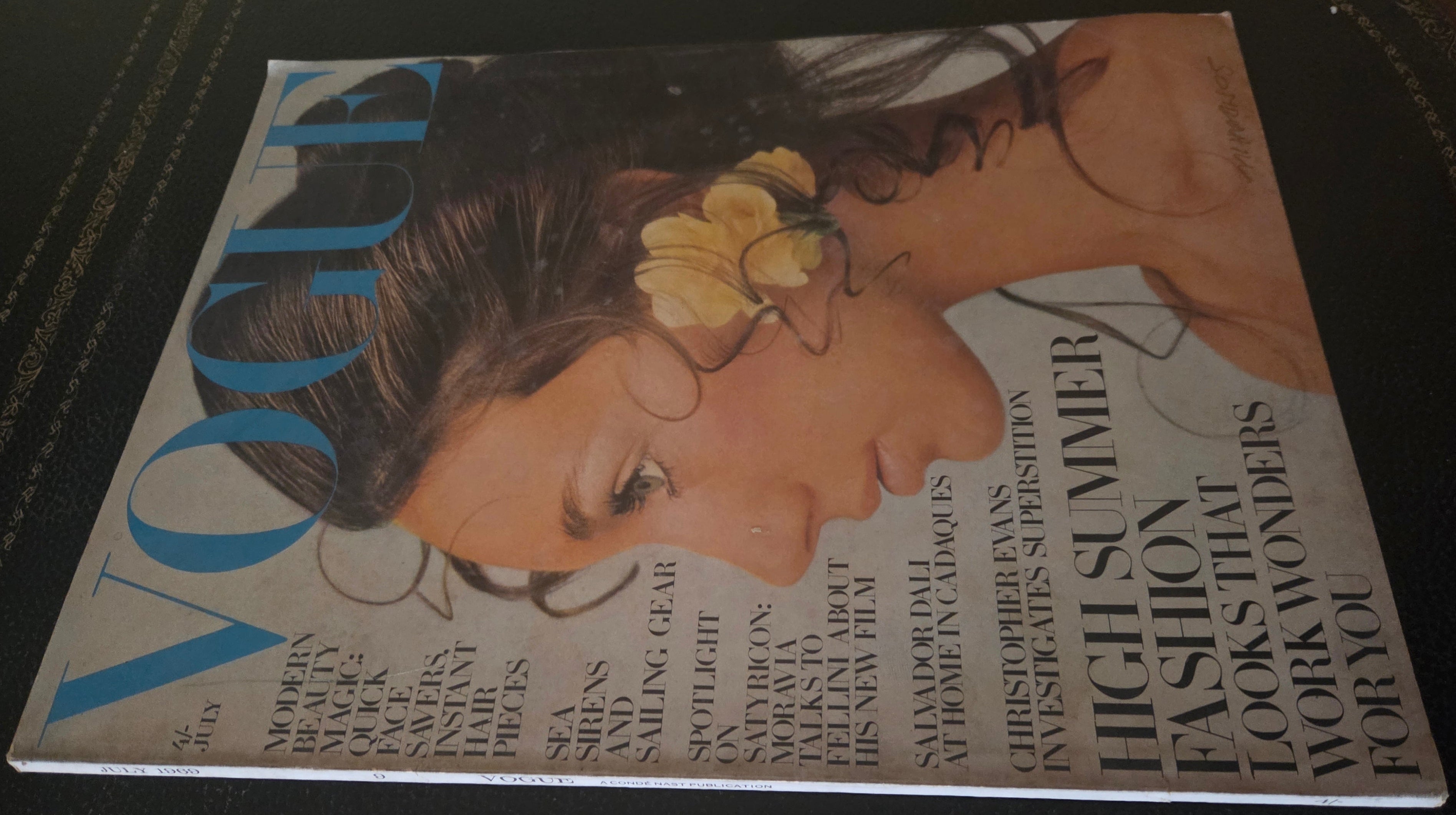 Vogue magazine with model wearing yellow flower earring.