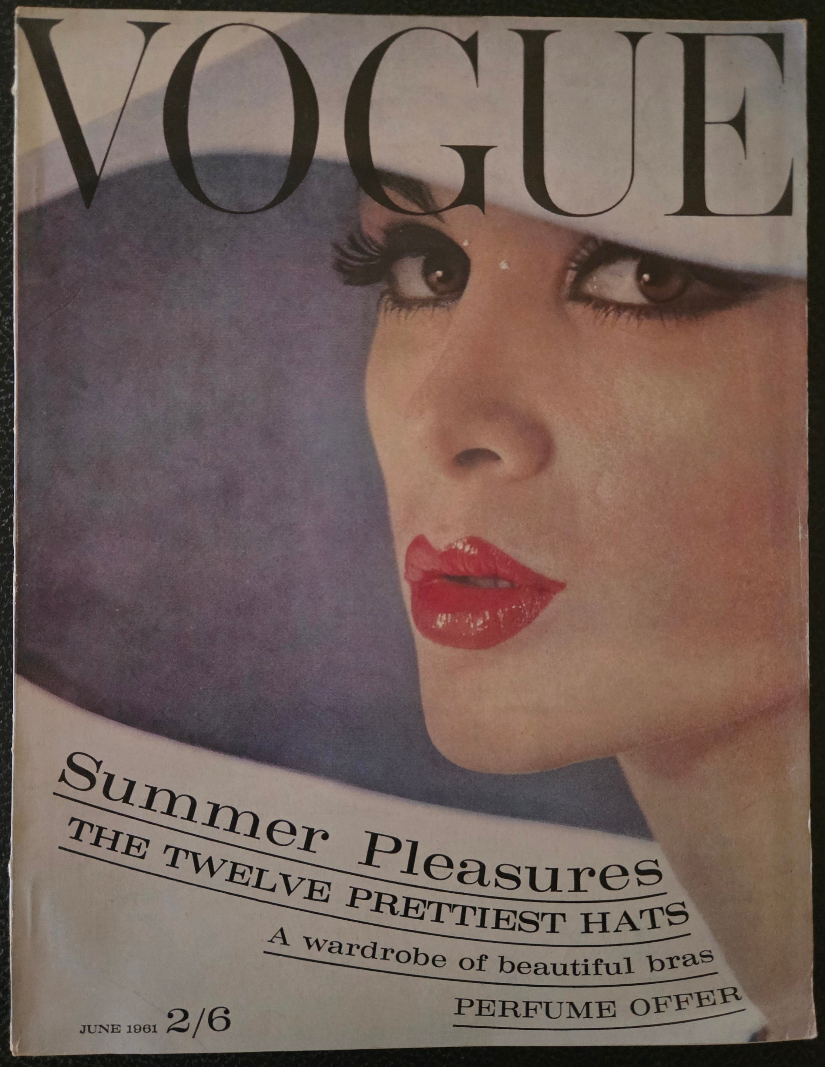 Vintage Vogue magazine cover with a woman's face and text