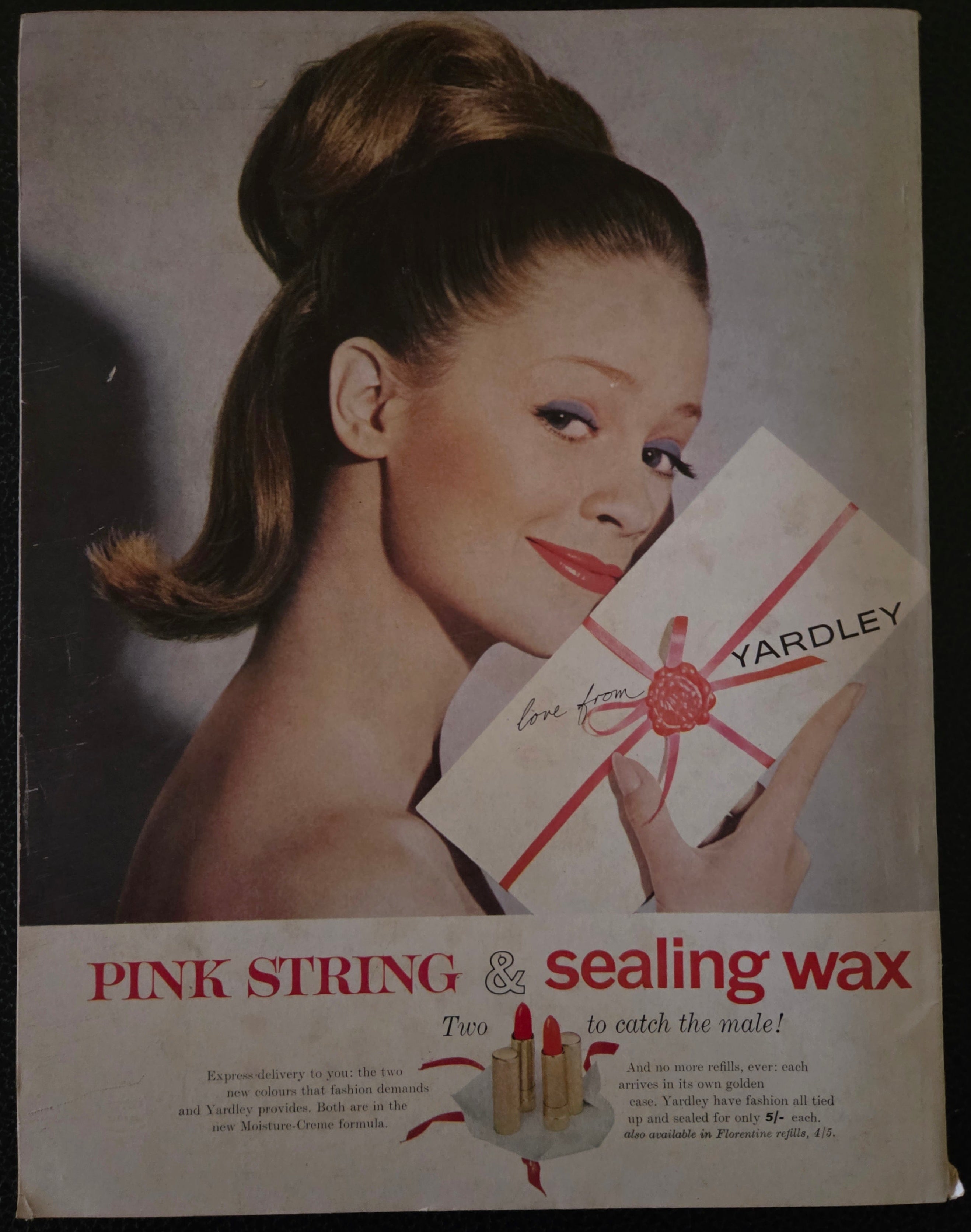Vintage advertisement for Yardley pink string and sealing wax with a woman holding a box.