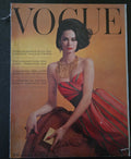 Vintage Vogue magazine cover with a model in a red dress 
