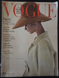 Vintage Vogue magazine cover with a woman wearing a large hat.