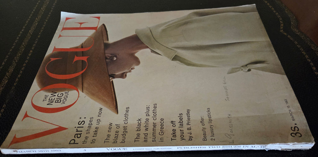 Vogue magazine cover with a woman wearing a hat.
