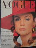 Vogue with model in red hat and big earrings