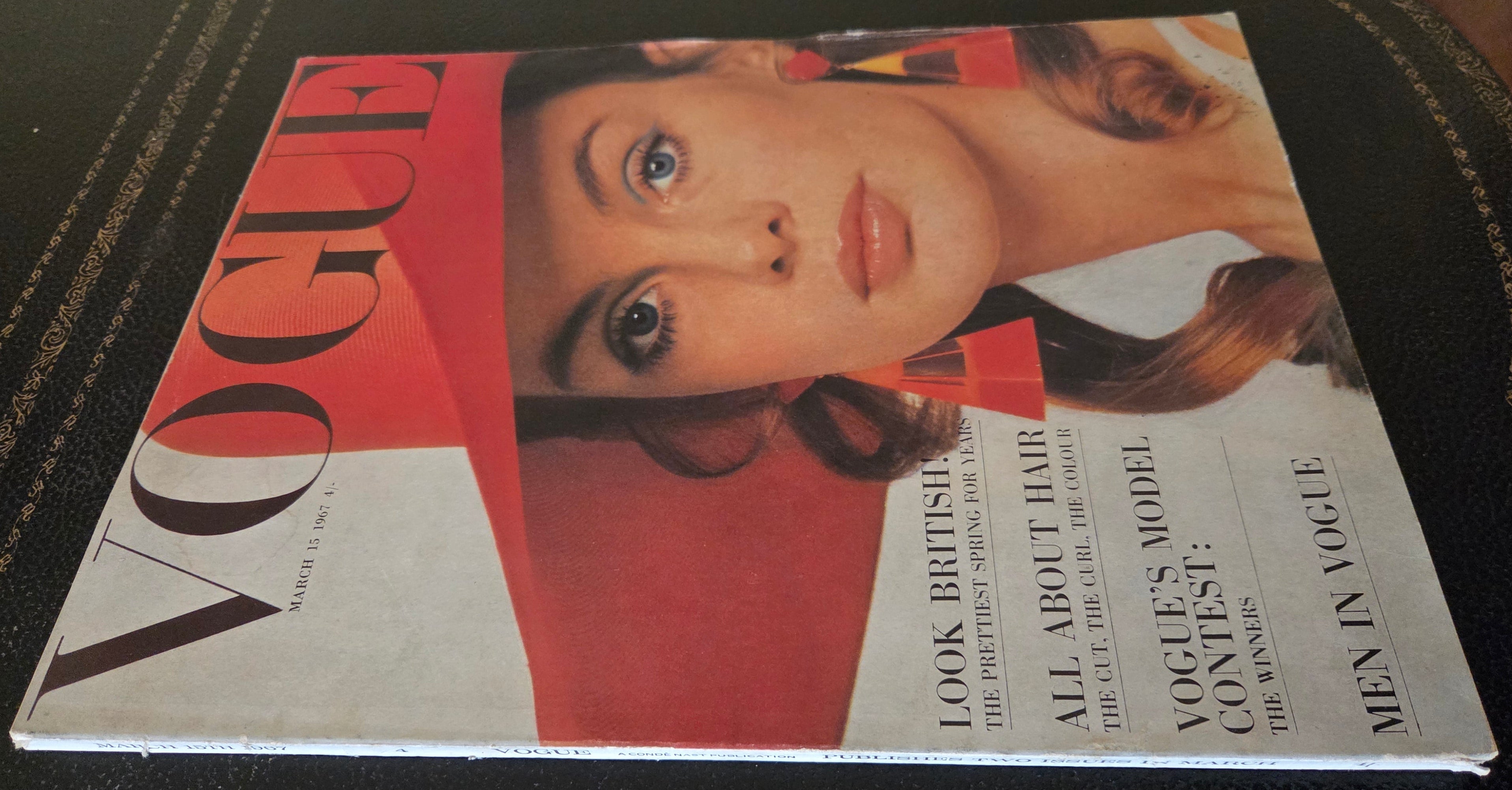 Vogue with model in red hat and big earrings.