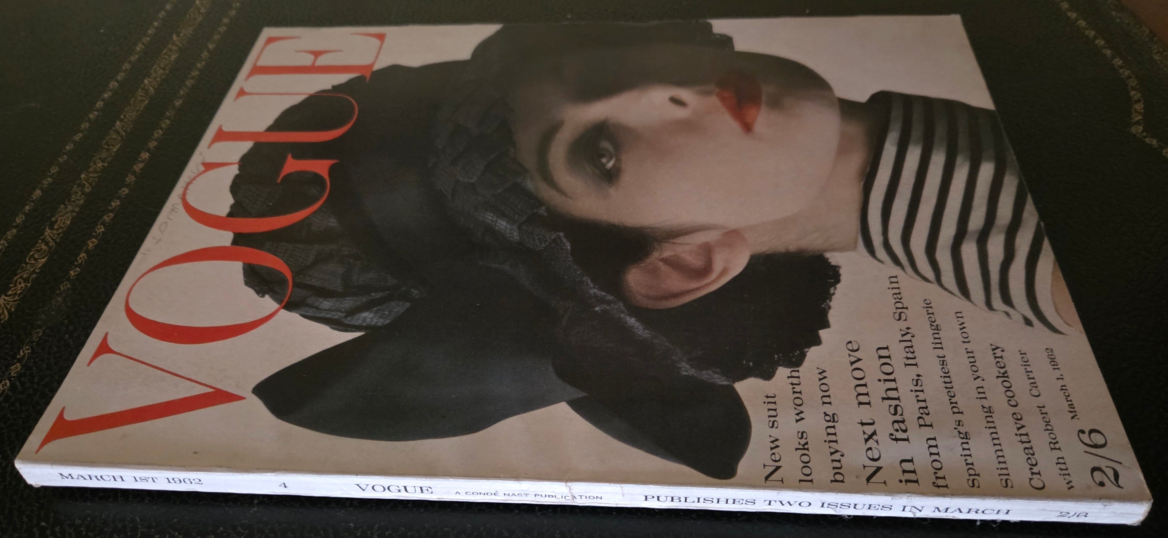 Vintage vogue with model wearing dark hat.