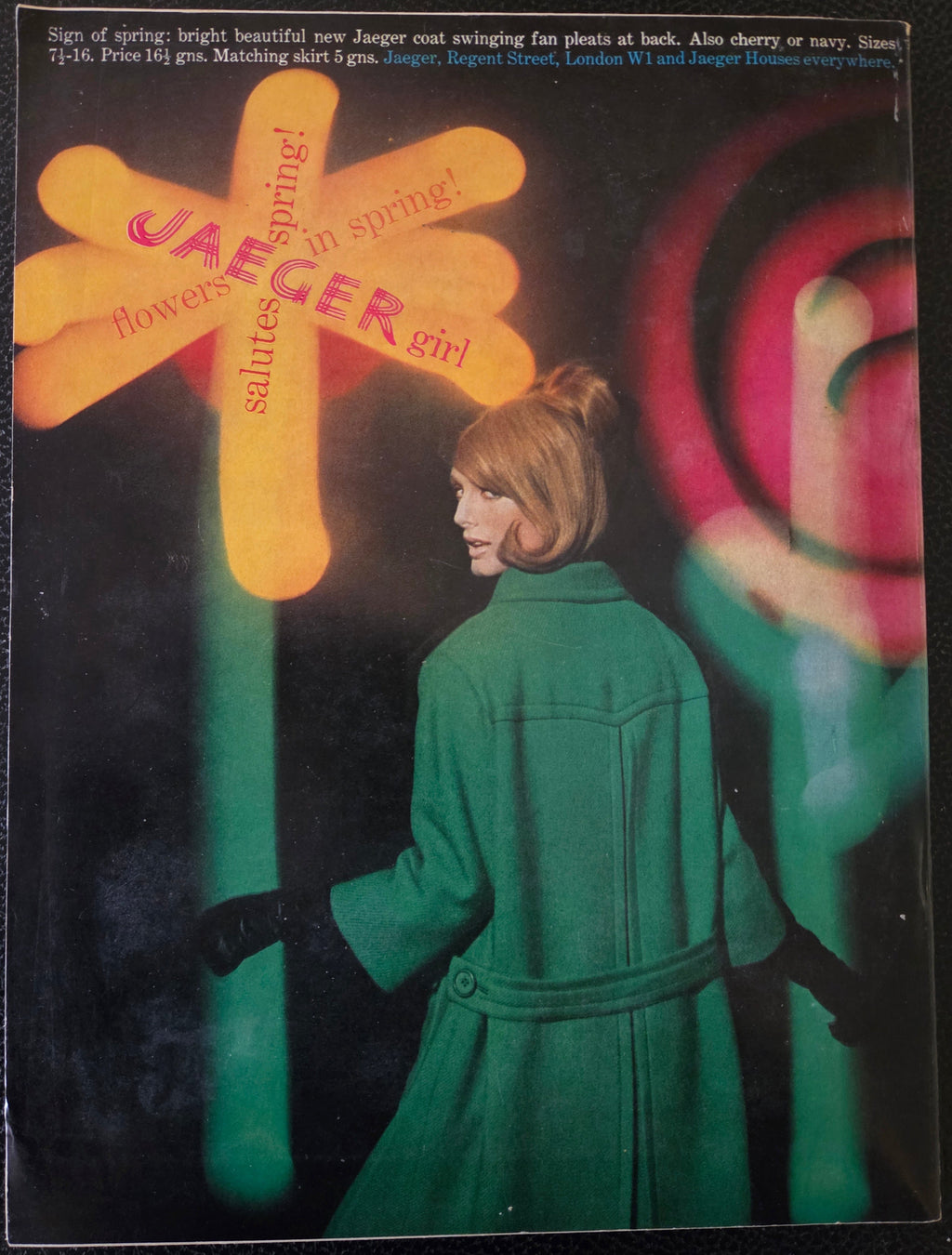 Vogue Jaeger Advert with woman in green coat.