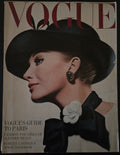 Vintage Vogue magazine cover with a woman's profile and floral detail
