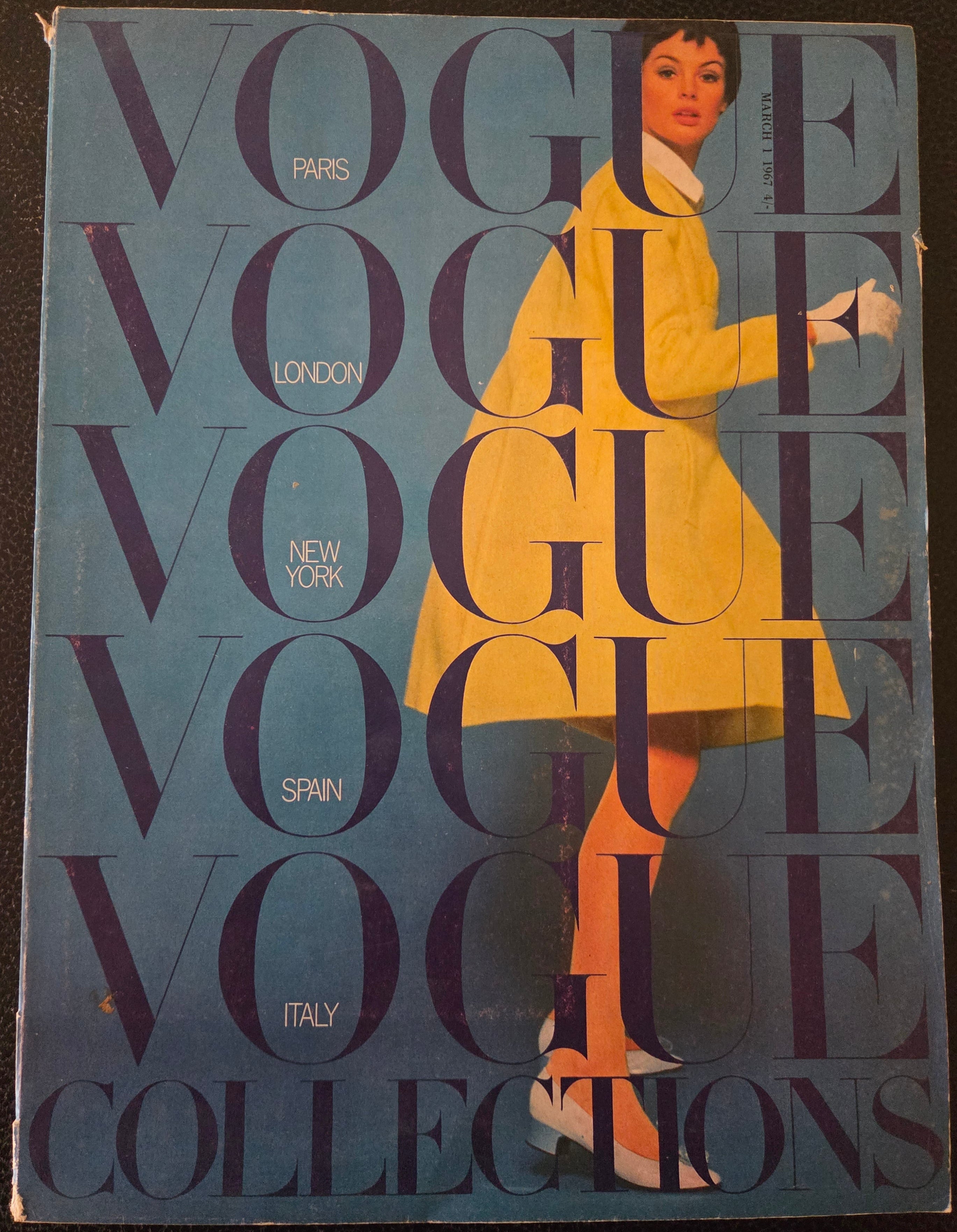 Vogue magazine with model in orange outfit.