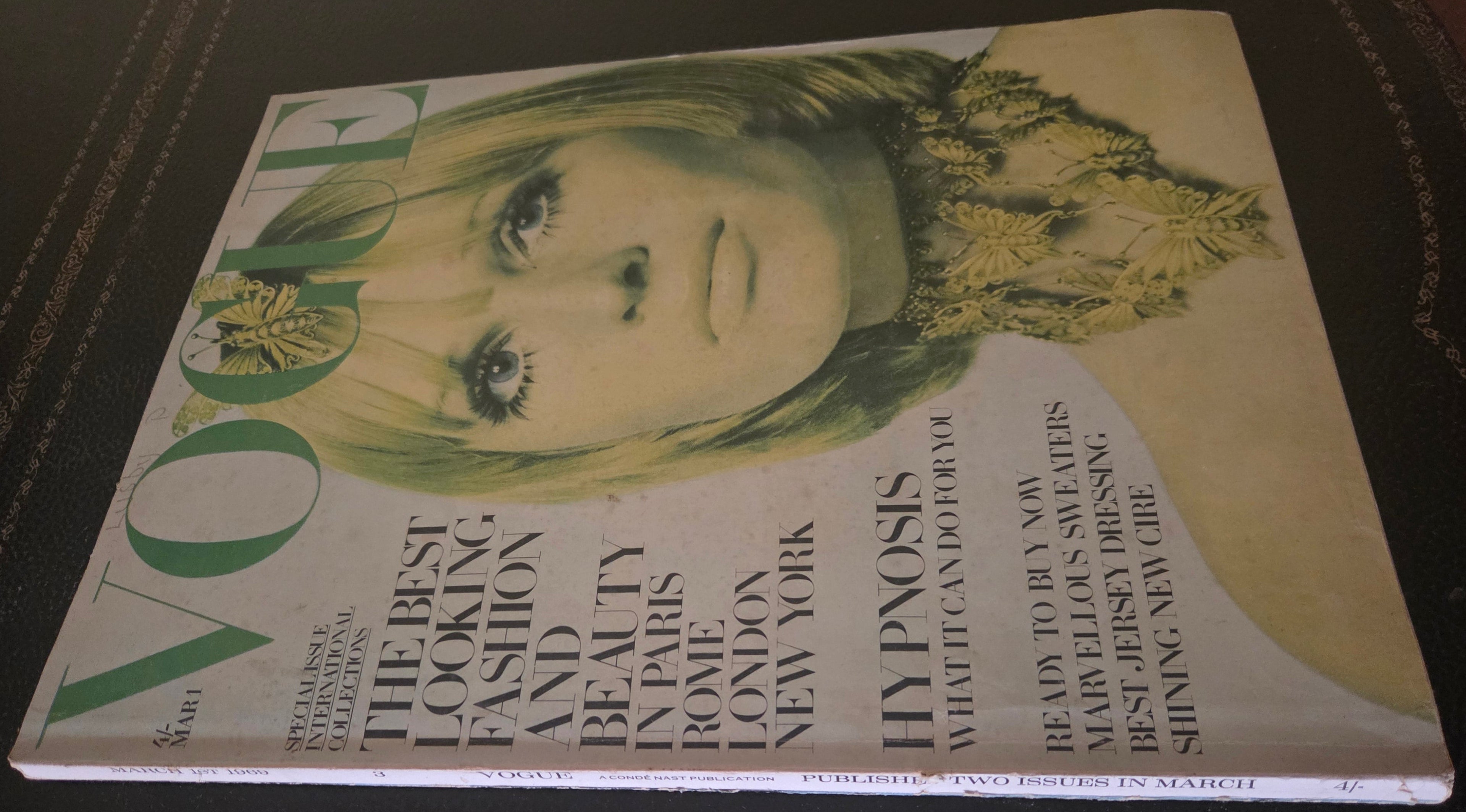 Vintage Vogue magazine cover with a model on the cover