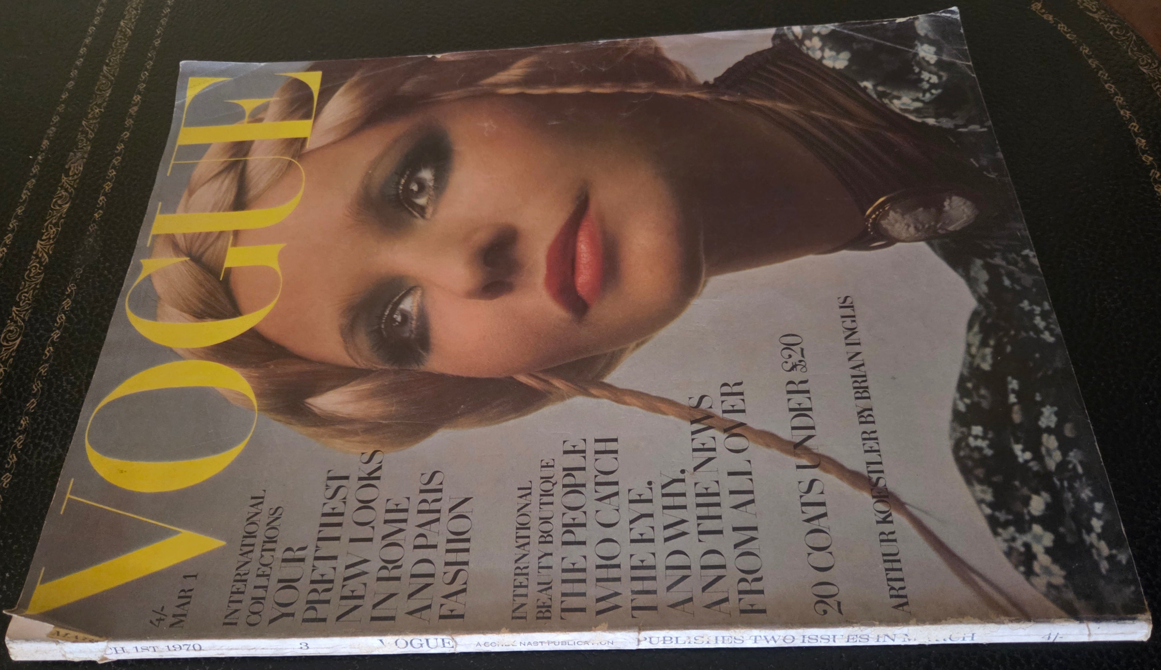 Vogue with model wearing hair in plaits.