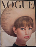Vintage Vogue magazine cover with a woman's face and text
