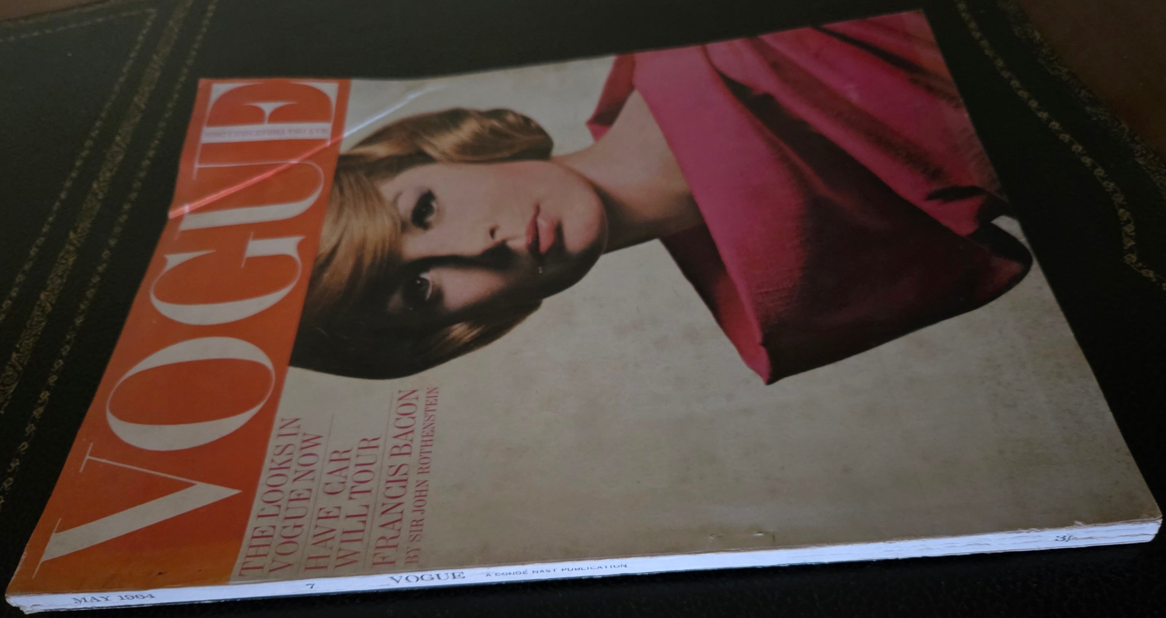 Vogue with model in pink outfit.