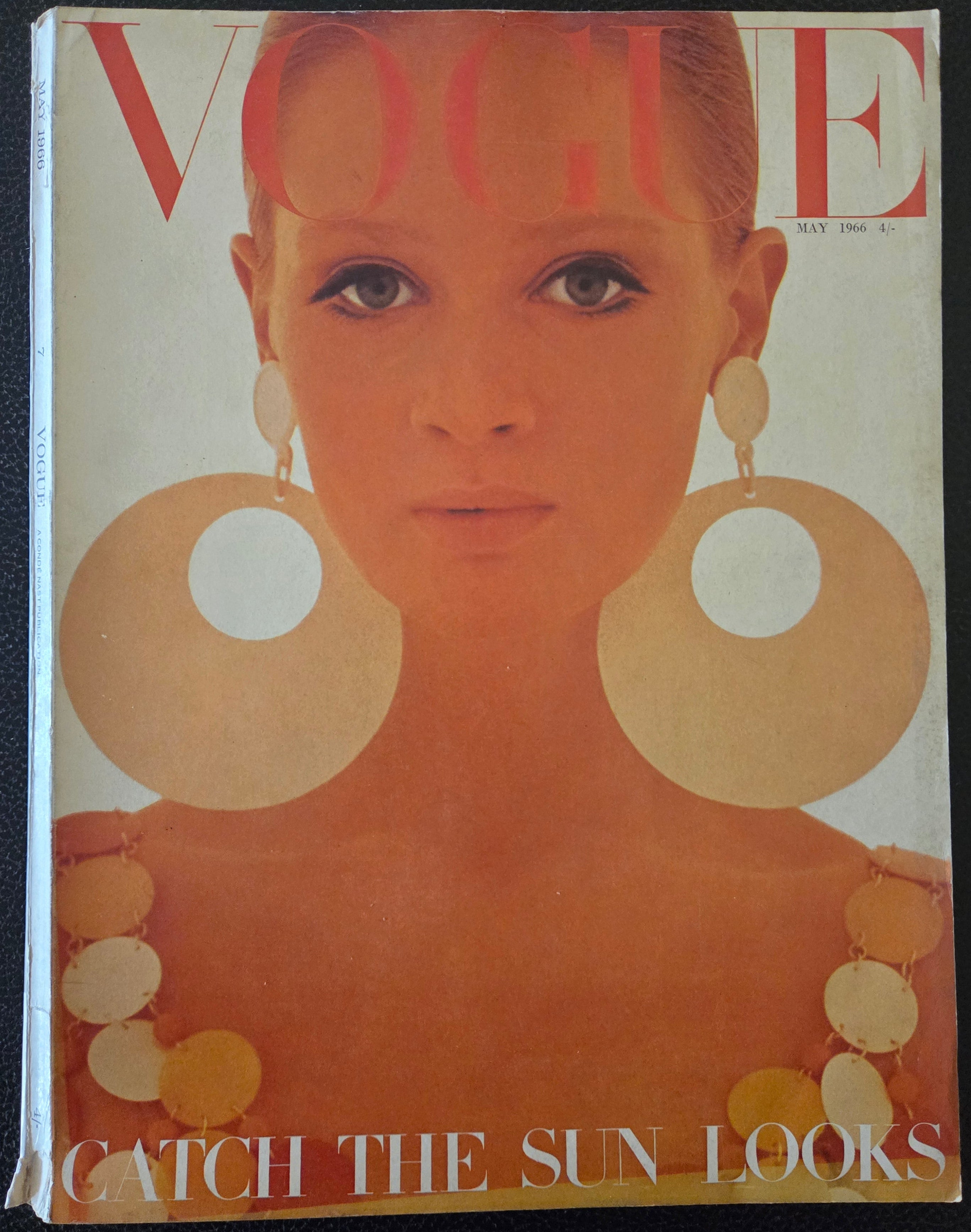 Vintage magazine cover with a stylized face and text 'Catch the Sun Looks'