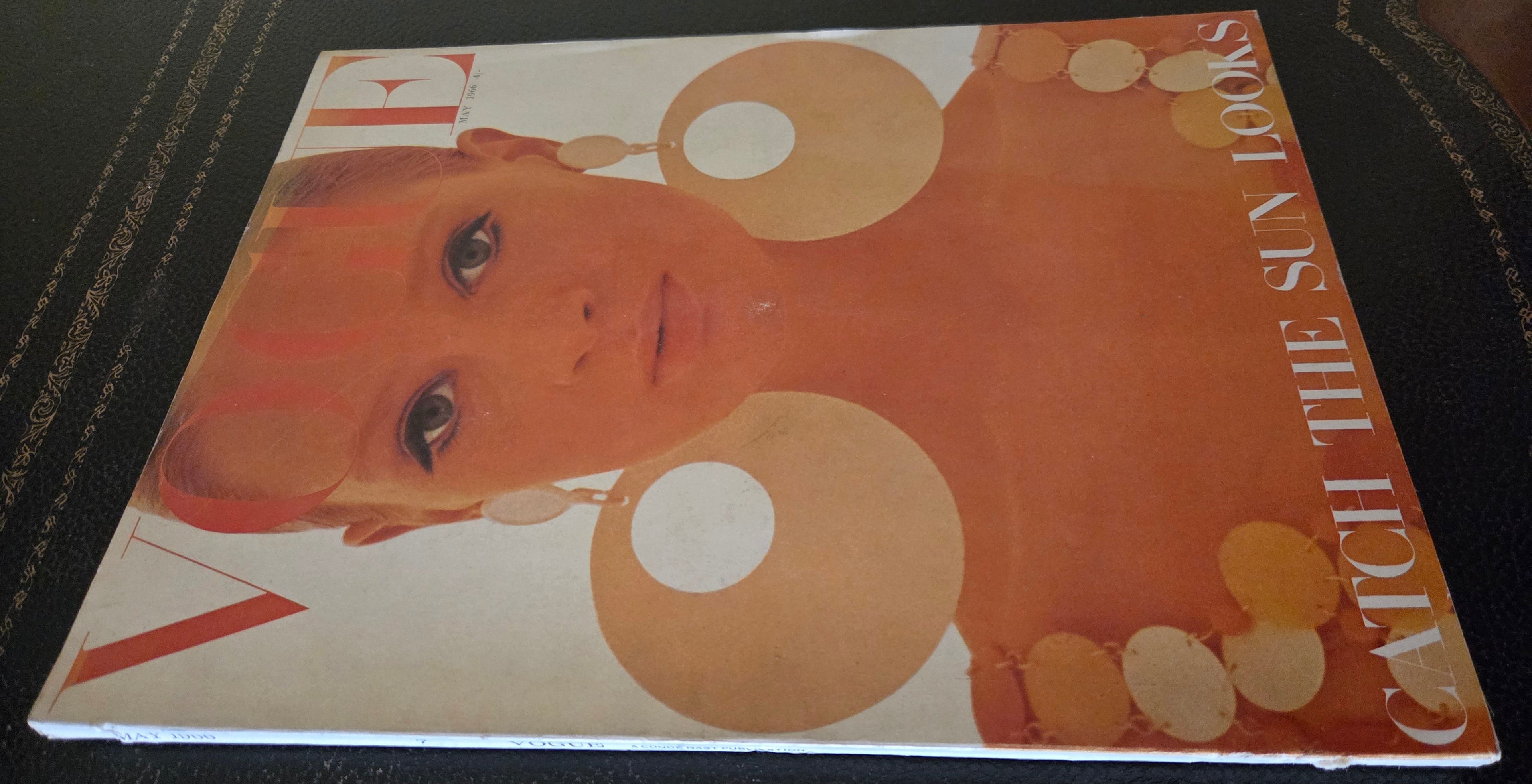 Vogue with model wearing large circular earrings