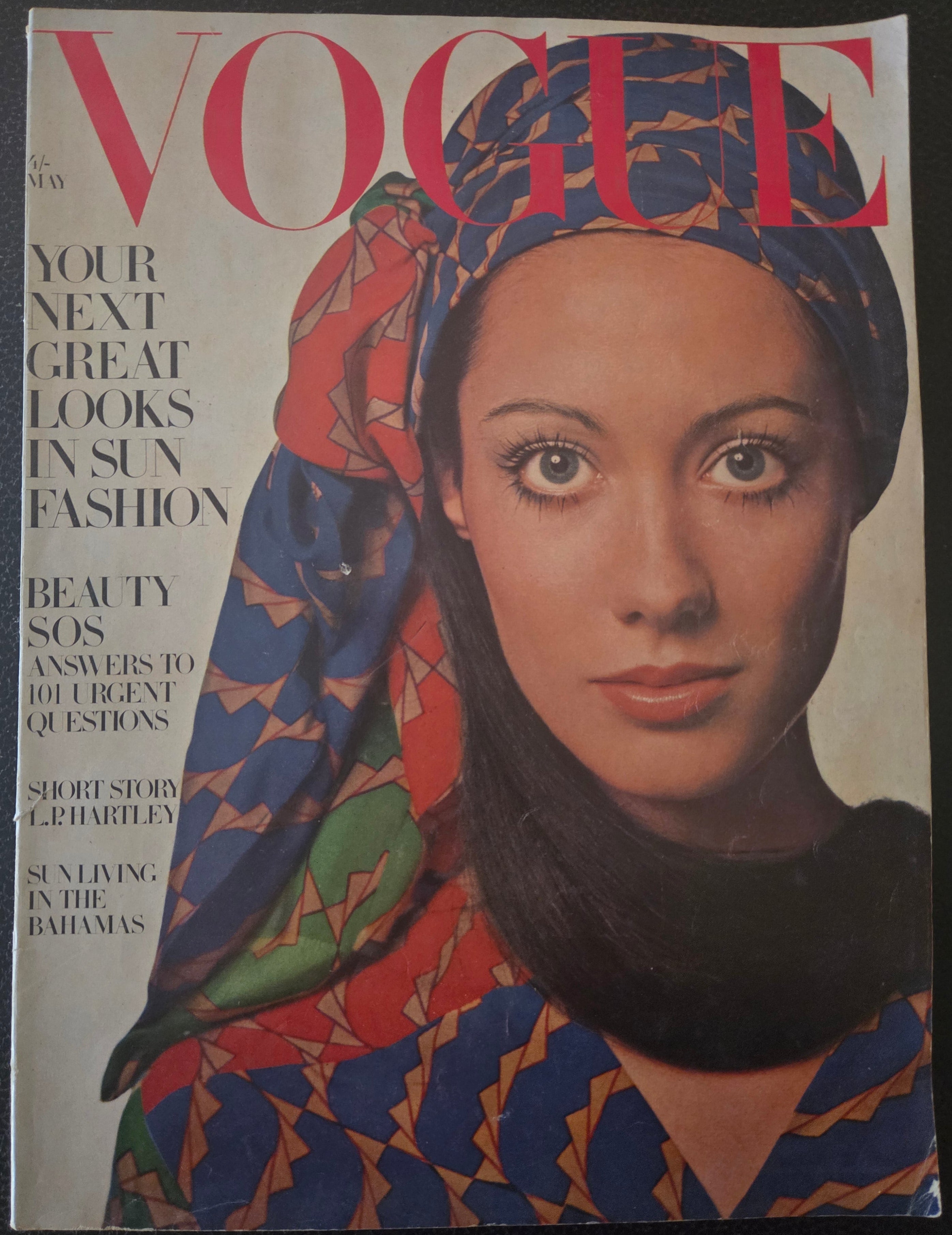 Vogue with model in red green blue headscarf