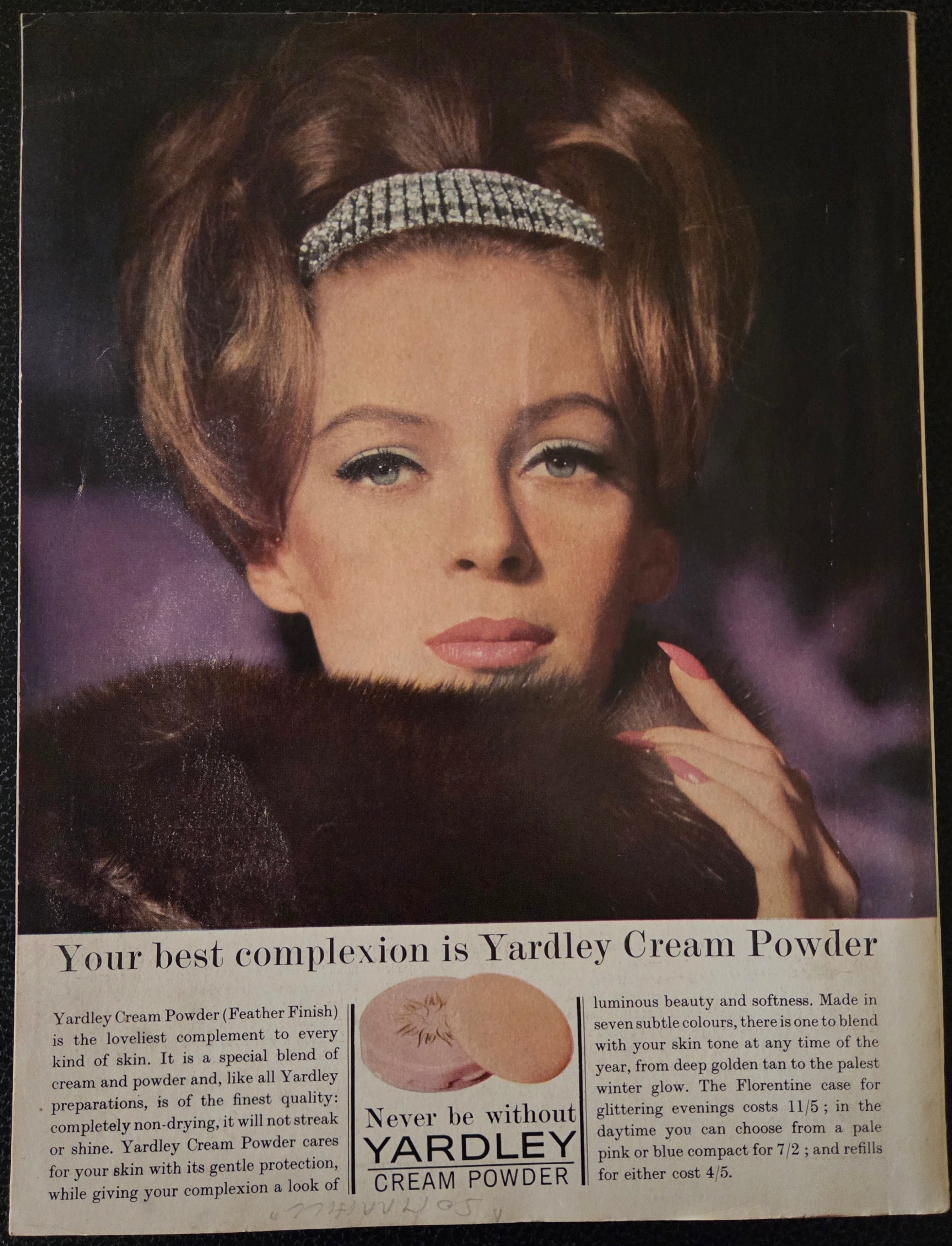 Vintage advertisement for Yardley Cream Powder featuring a woman with a fur coat and diamond headband.