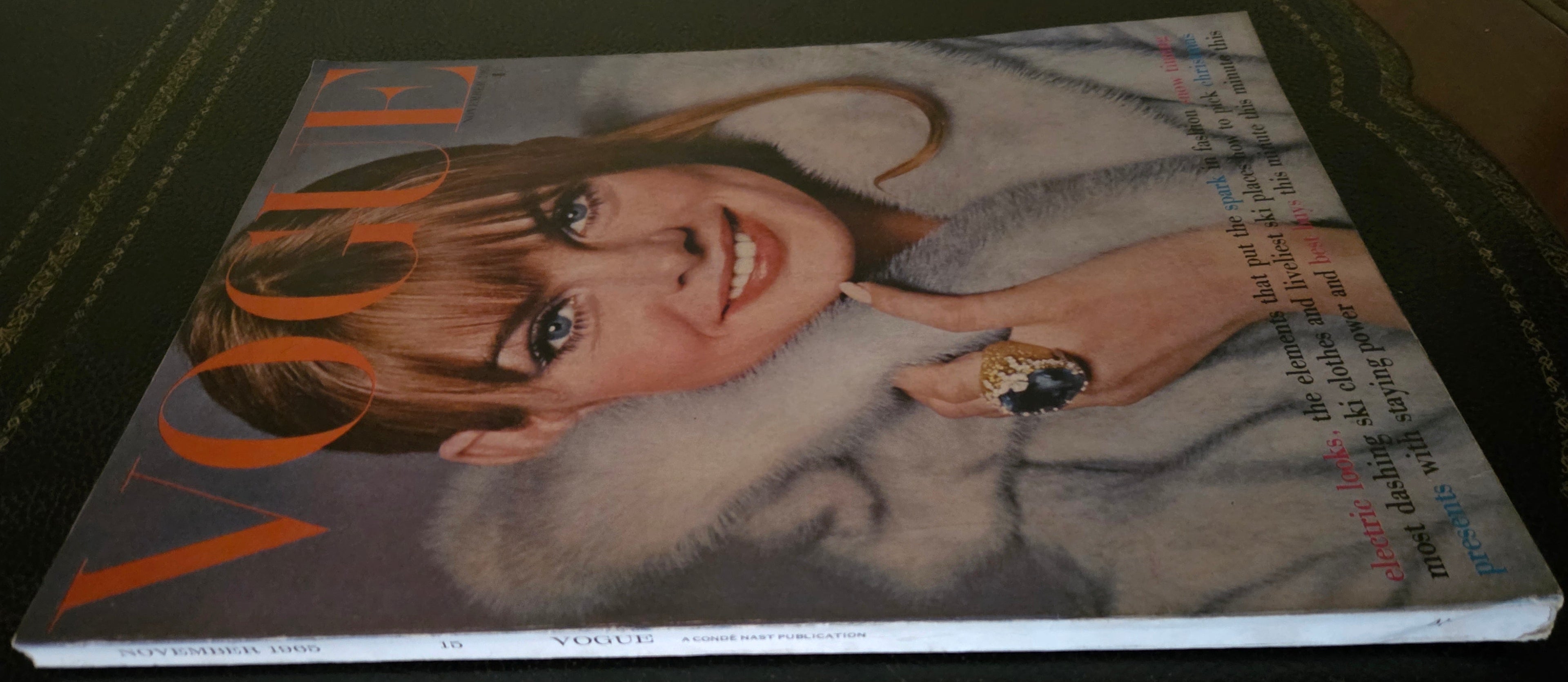 Vintage vogue with model in fur coat and big gold ring.