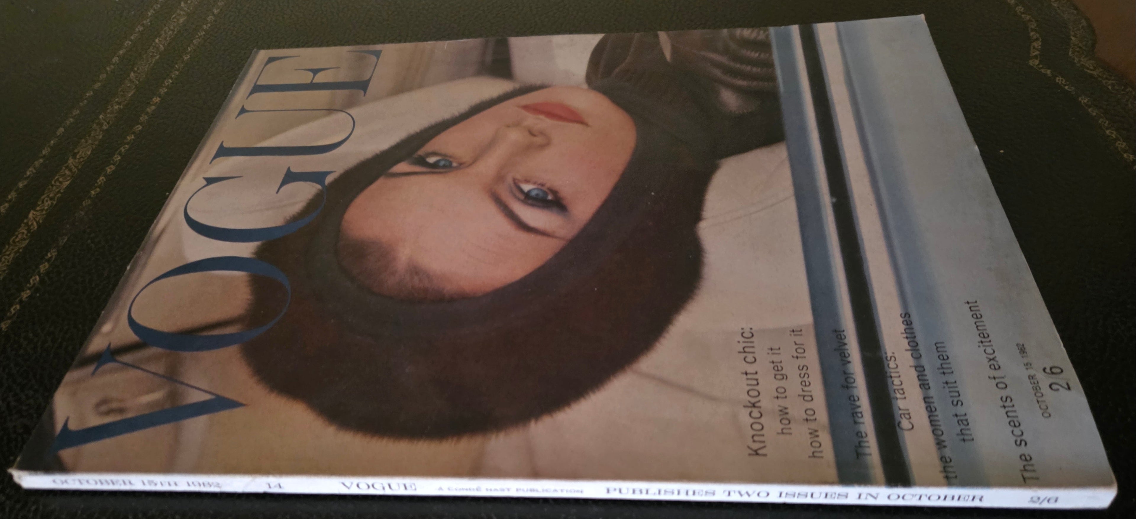 Vogue magazine with a cover featuring a model in fur hood.