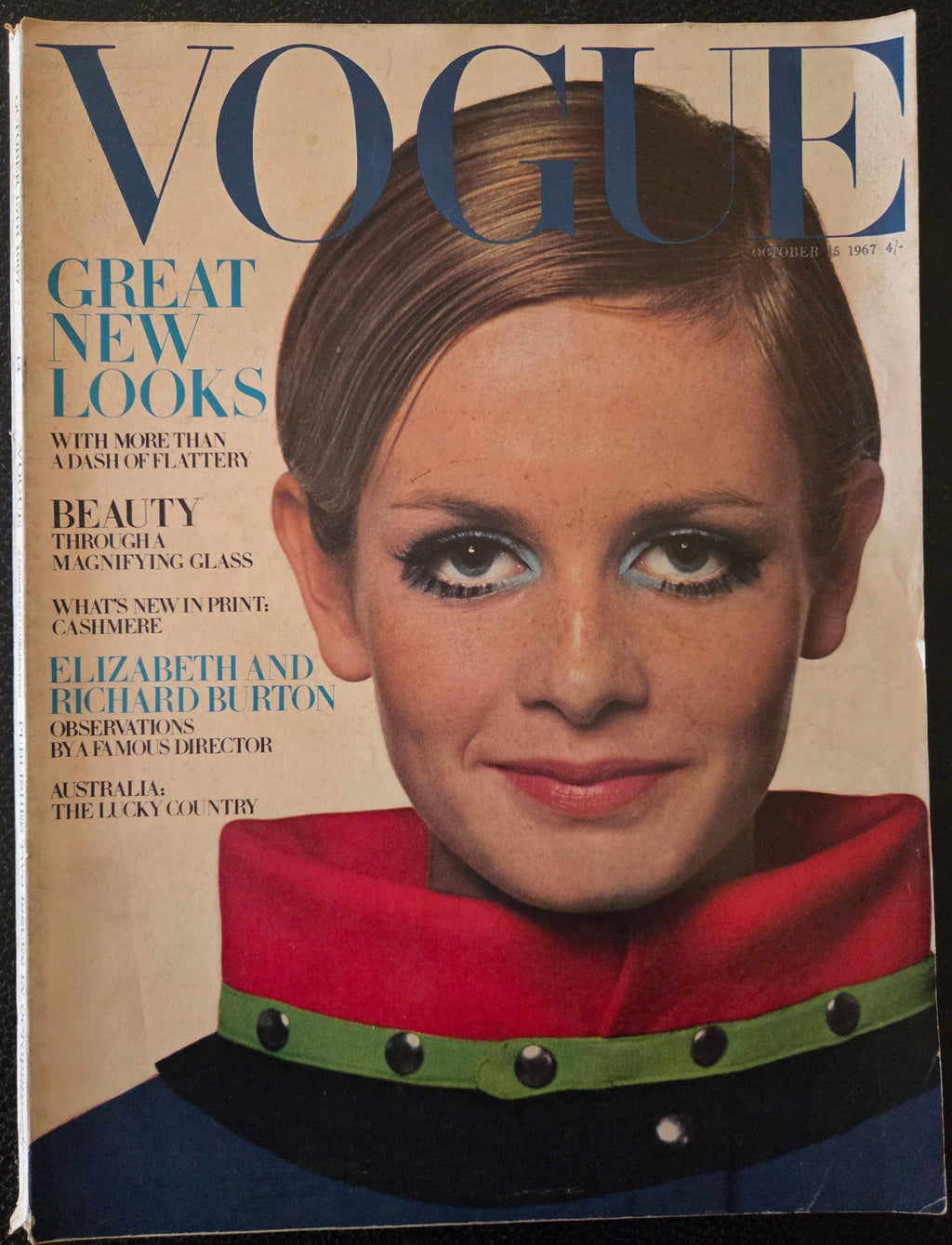 Vogue with model wearing red coloured coat.