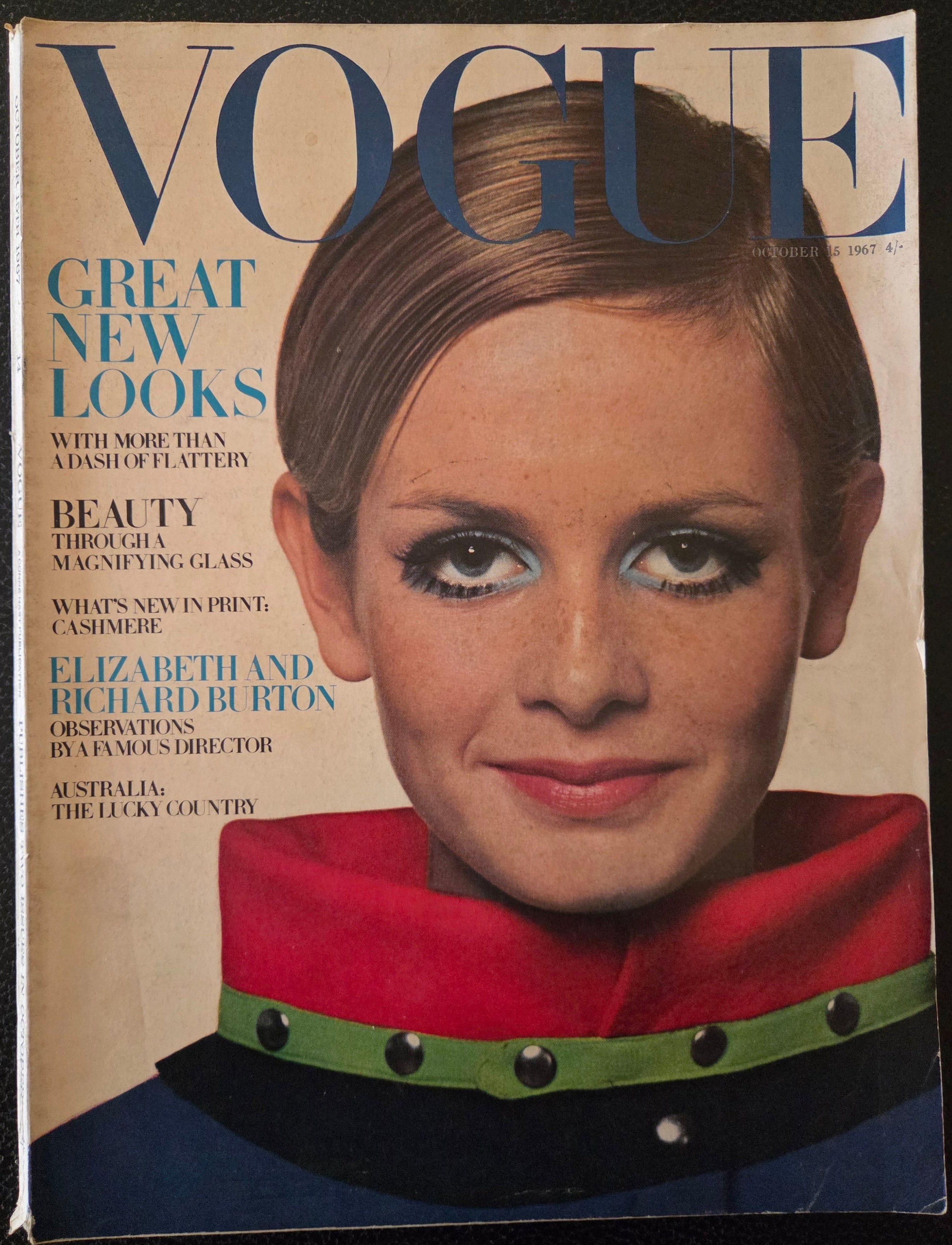 Vogue with model wearing red coloured coat.